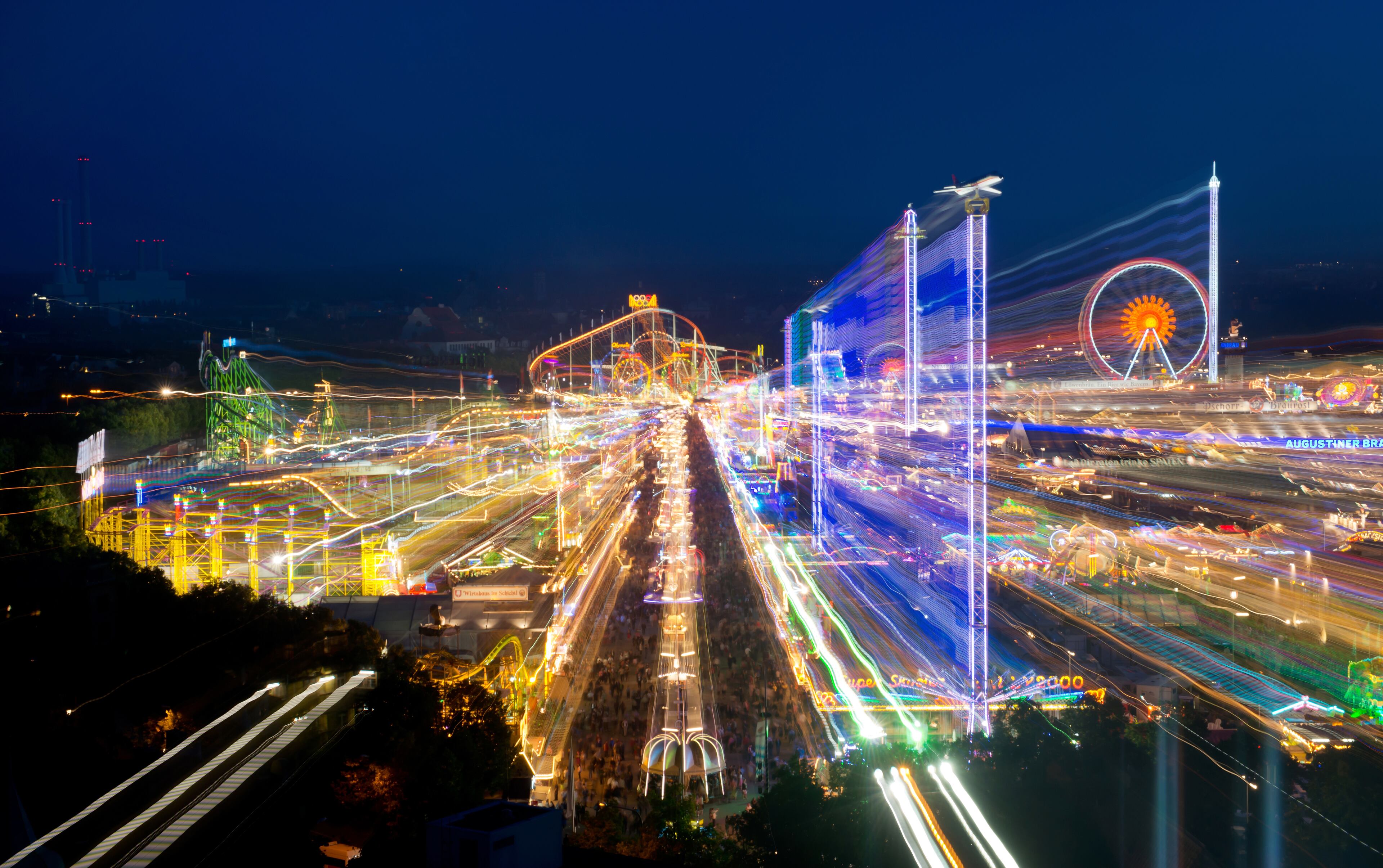 MUNICH, GERMANY - SEPTEMBER 21: Visitors enjoy the Oktoberfest 2013 beer festival at Theresienwiese on September 21, 2013 in Munich, Germany. The Munich Oktoberfest, which this year will run from September 21 through October 6, is the world's largest beer fest and draws millions of visitors. (Photo by Joerg Koch/Getty Images)