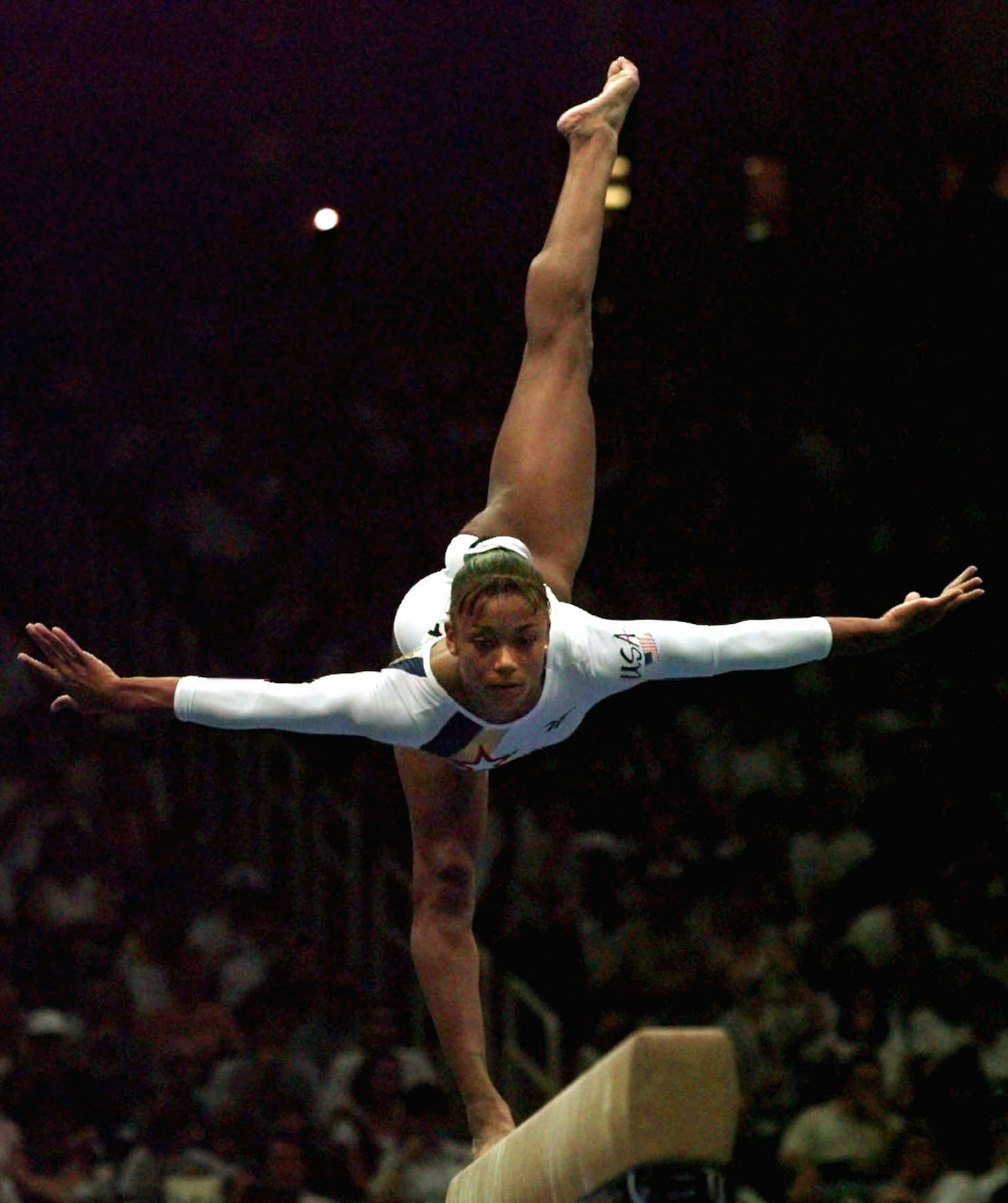 USA's Dominique Dawes, of Gaithersburg, Md., performs her routine on the balance beam at the women's team compulsory gymnastics competition of the Centennial Summer Olympic Games in Atlanta on July 21, 1996. (Amy Sancetta/AP)