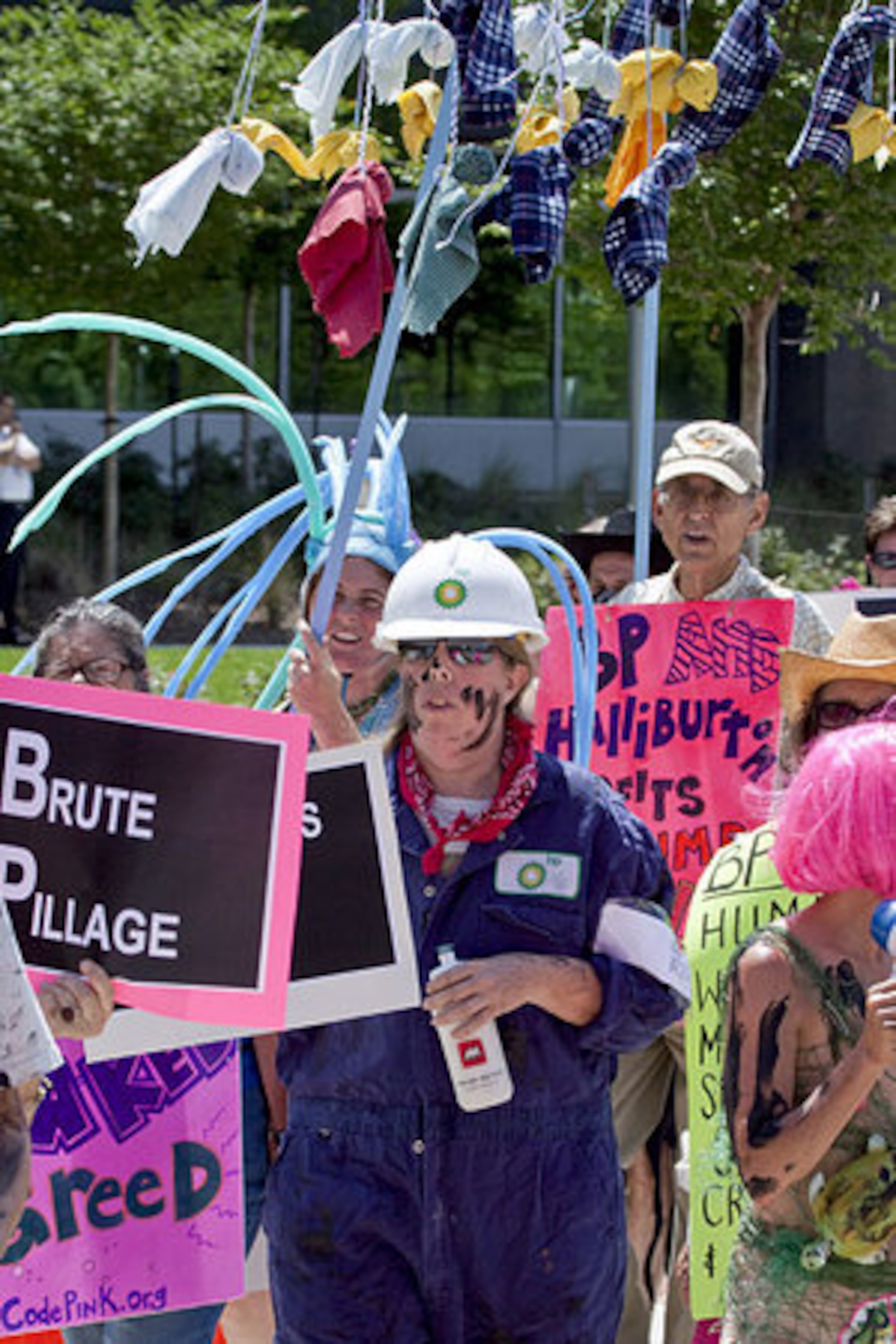 Pink activists demonstrate outside the U.S. headquarters of BP Plc in Houston, Texas, U.S., on Monday, May 24, 2010.