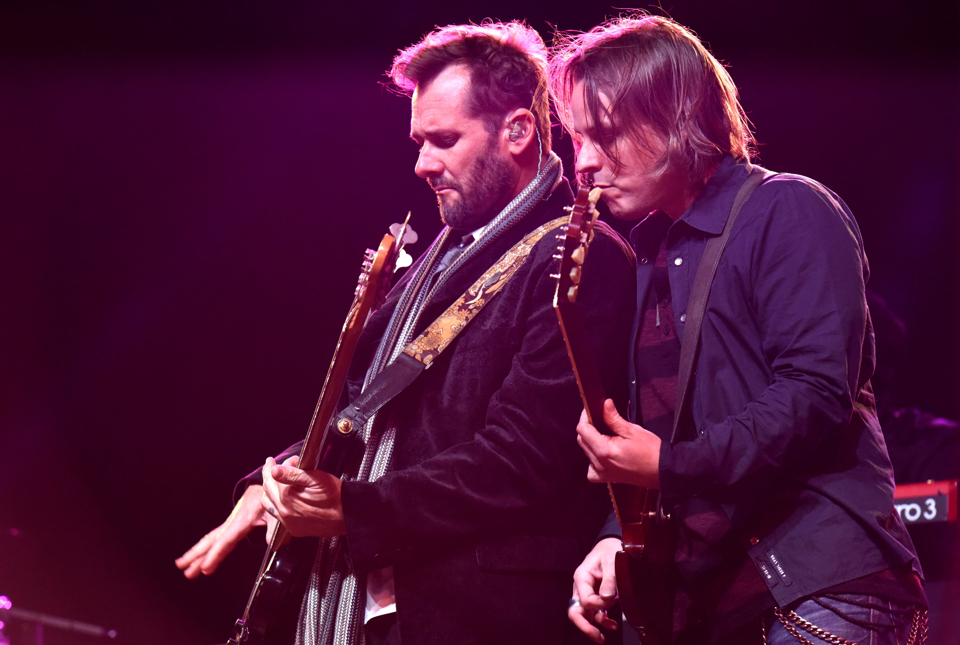 Sister Hazel members Andrew Copeland (left) and Ryan Newell perform at Underground Atlanta during Peach Drop 2016 on December 31, 2015. HYOSUB SHIN / HSHIN@AJC.COM