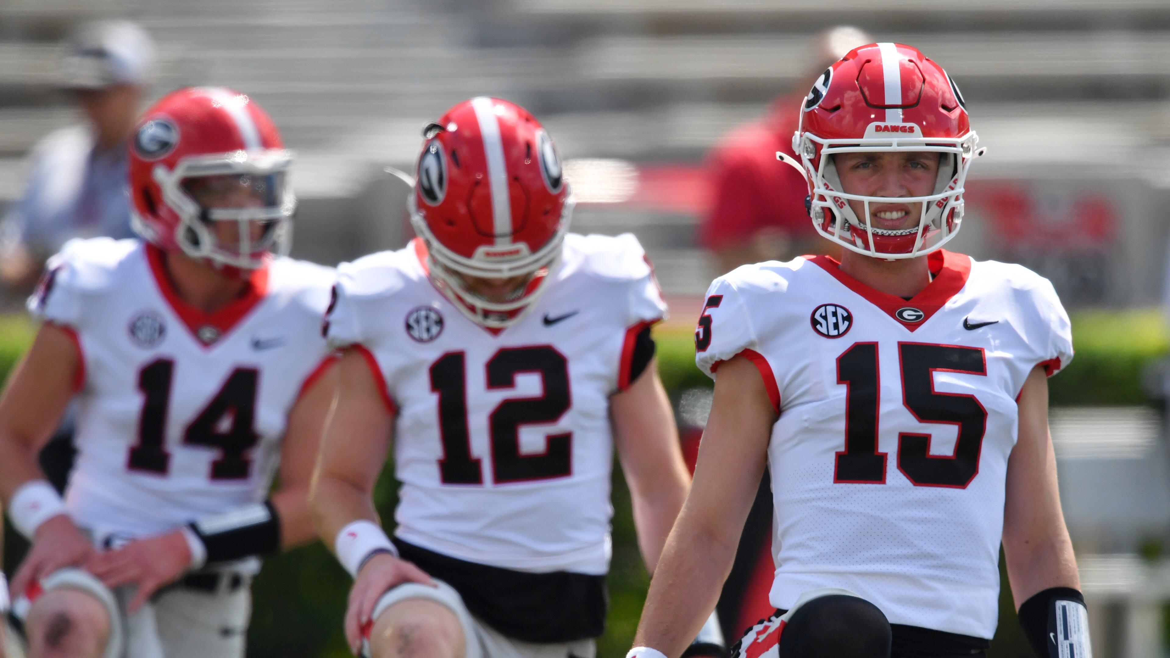 Georgia's quarterbacks (from left) Gunner Stockton (14), Brock Vandagriff (12) and Carson Beck (15) warm up before the G - Day game at Sanford Stadium, Saturday, April 15, 2023, in Athens. (Hyosub Shin / Hyosub.Shin@ajc.com)