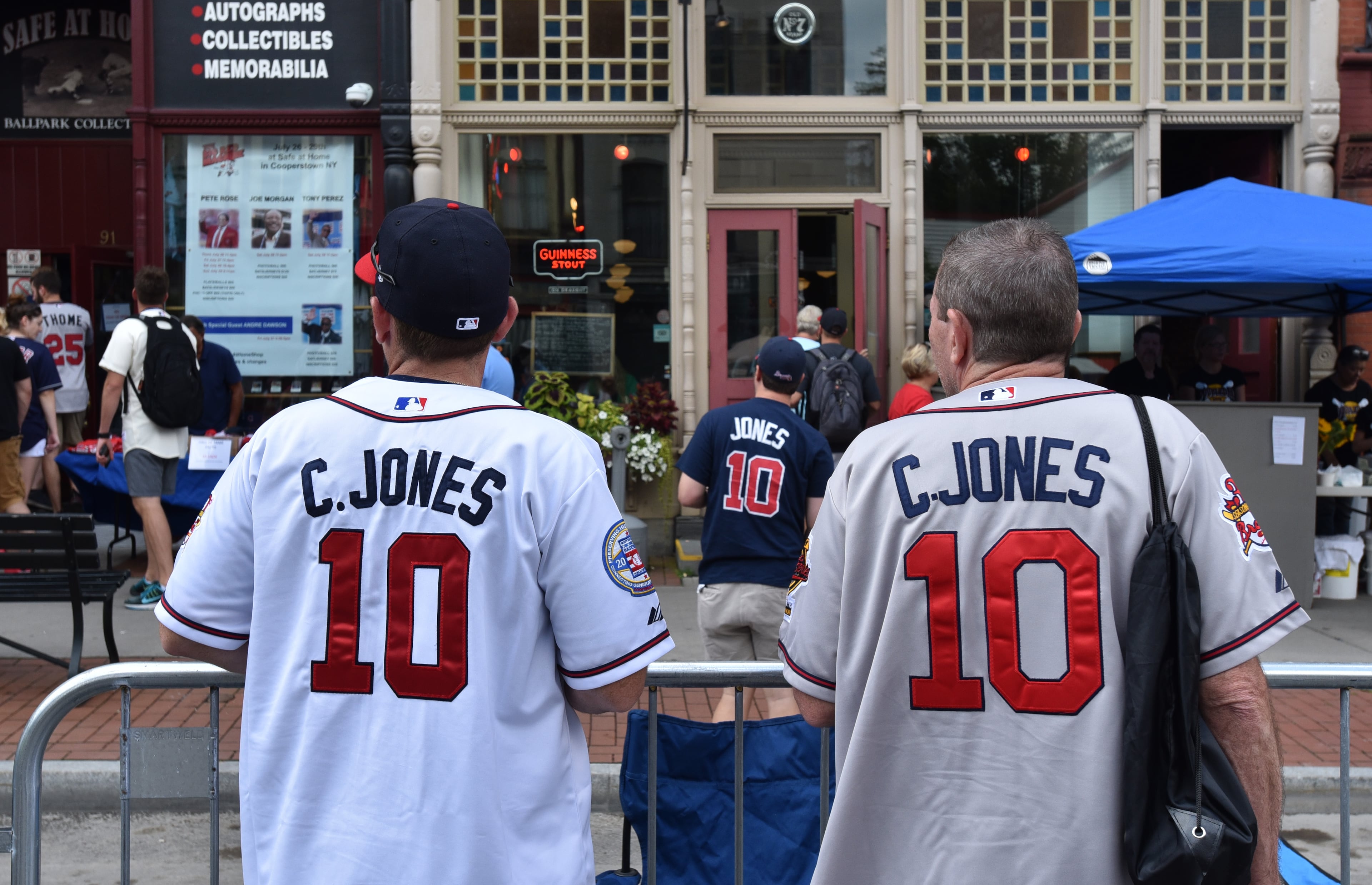 July 28, 2018 Cooperstown, N.Y. - Chipper Jones fans wearing #10 baseball jersey walk around on Main Street where Hall of Fame Legends Parade will take place this evening in Cooperstown, N.Y. on Saturday, July 28, 2018. Braves legend Chipper Jones is set for induction into the National Baseball Hall of Fame on Sunday in Cooperstown, N.Y. HYOSUB SHIN / HSHIN@AJC.COM