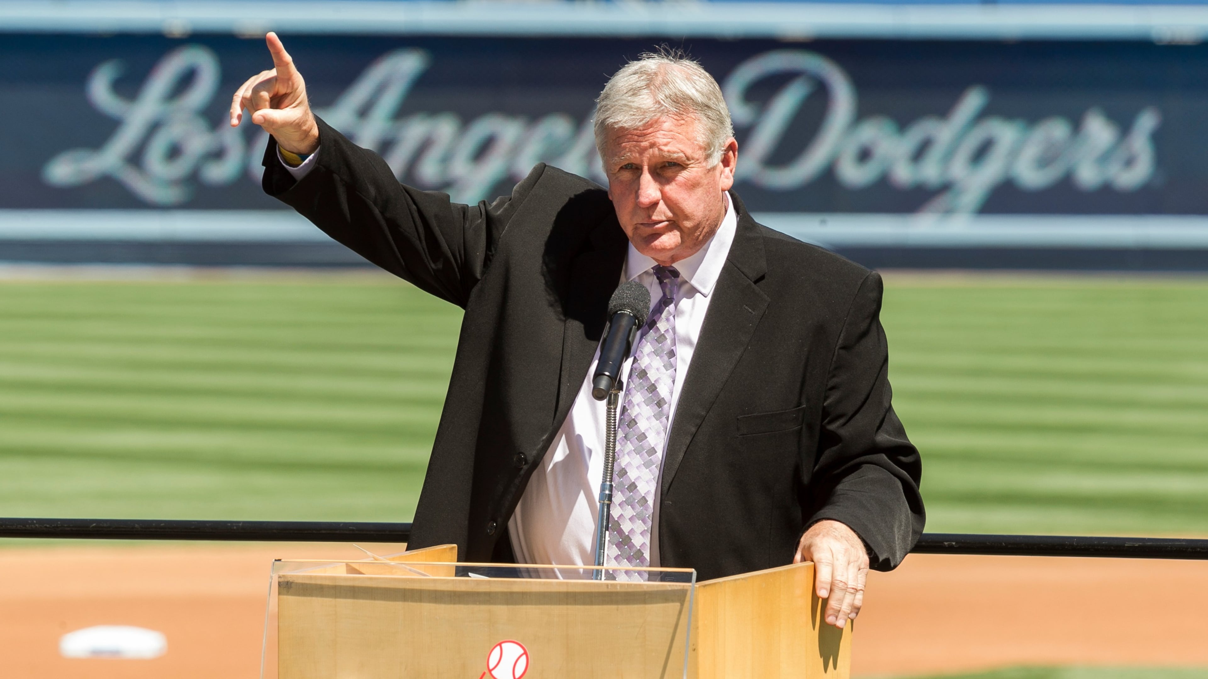 FILE - Los Angeles Dodgers former pitcher Tommy John praises his late friend, Dr. Frank Jobe during a memorial service at Dodger Stadium in Los Angeles, April 7, 2014. (AP Photo/Damian Dovarganes, File)