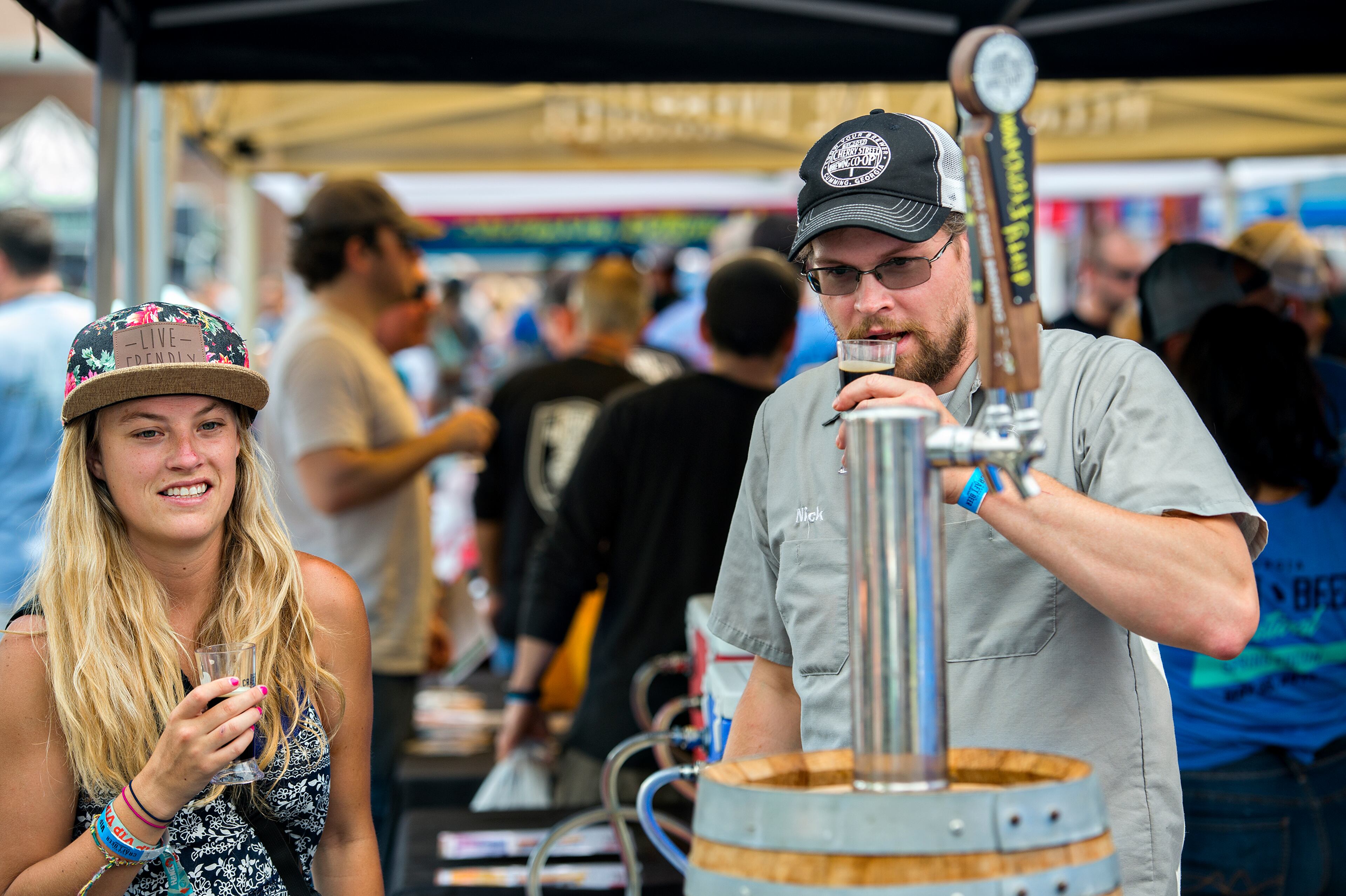 May 30, 2015 Atlanta - Ashford McIntyre (left) talks with Nick Tanner as they sample beer during the Georgia Craft Beer Festival outside of Red Brick Brewing in Atlanta on Saturday, May 30, 2015. Hundreds of people came out to taste beer from 30 local Georgia breweries. JONATHAN PHILLIPS / SPECIAL