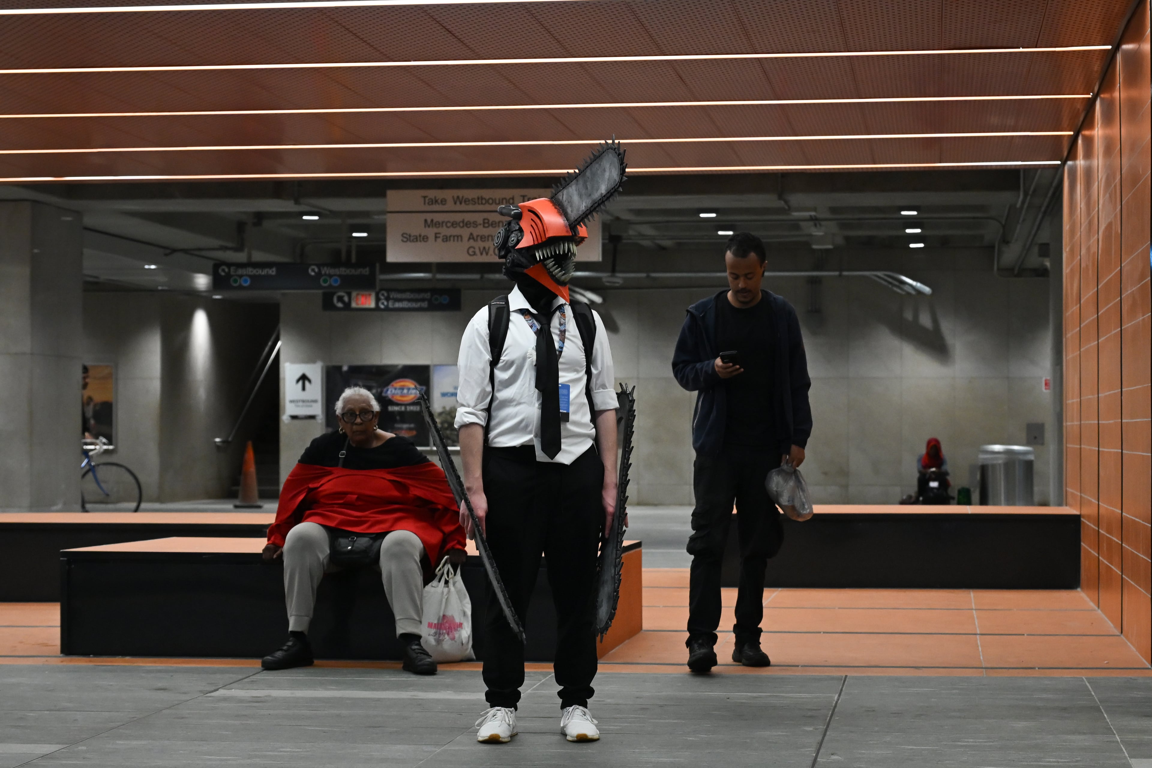 A MomoCon attendee, dressed as Denji from the Japanese series "Chainsaw Man," waits for the train in MARTA Five Points Station in Atlanta on Friday, May 22, 2026. Momocon is an annual gaming, animation and art convention held at the Georgia World Congress Center. (Tyler Sun for the AJC)