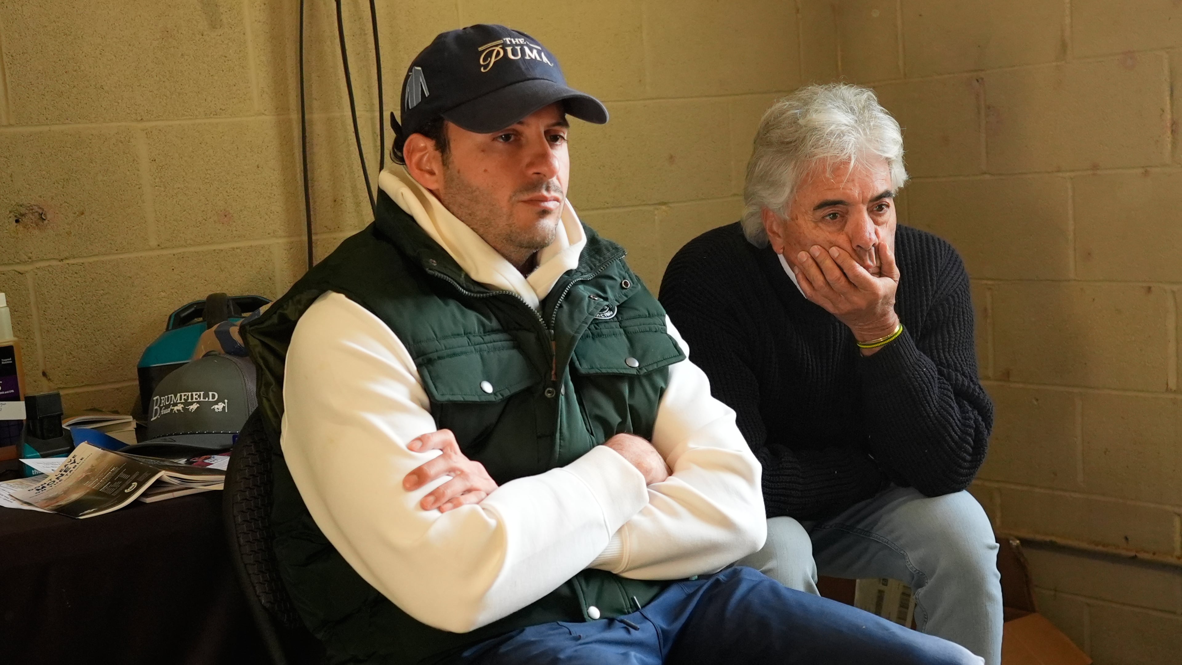 Trainers Gustavo Delgado Sr. and his son Gustavo Delgado Jr. watch a video of workouts after taking their horse, Kentucky Derby entrant The Puma, for a workout at Churchill Downs Thursday, April 30, 2026, in Louisville, Ky. (AP Photo/Charlie Riedel)