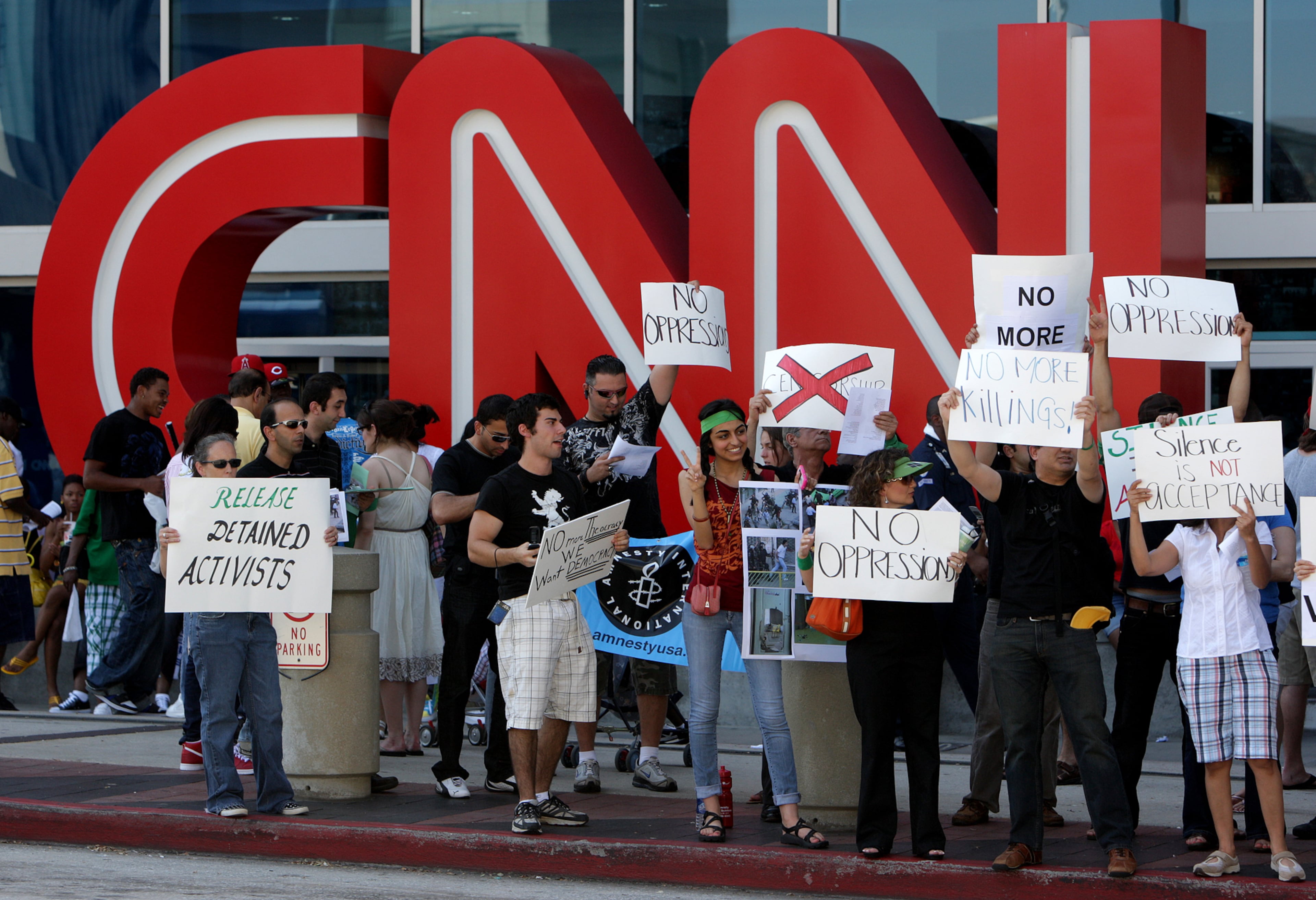 Protesters of the government of Iran carried signs outside CNN Center in June 2009. Johnny Crawford/ AJC