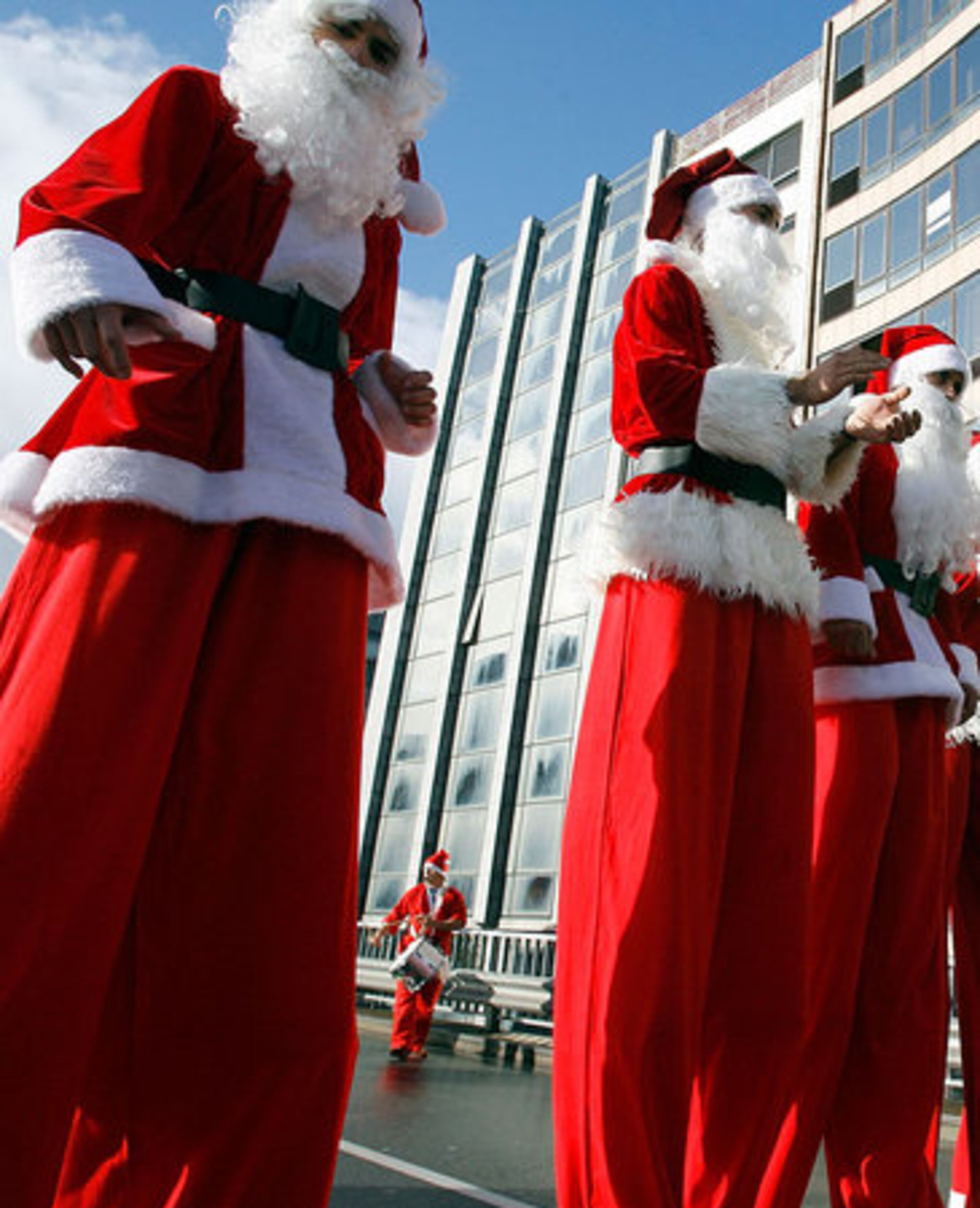Santas stand tall thanks to stilts at the annual Santa Claus parade in Porto, Portugal.