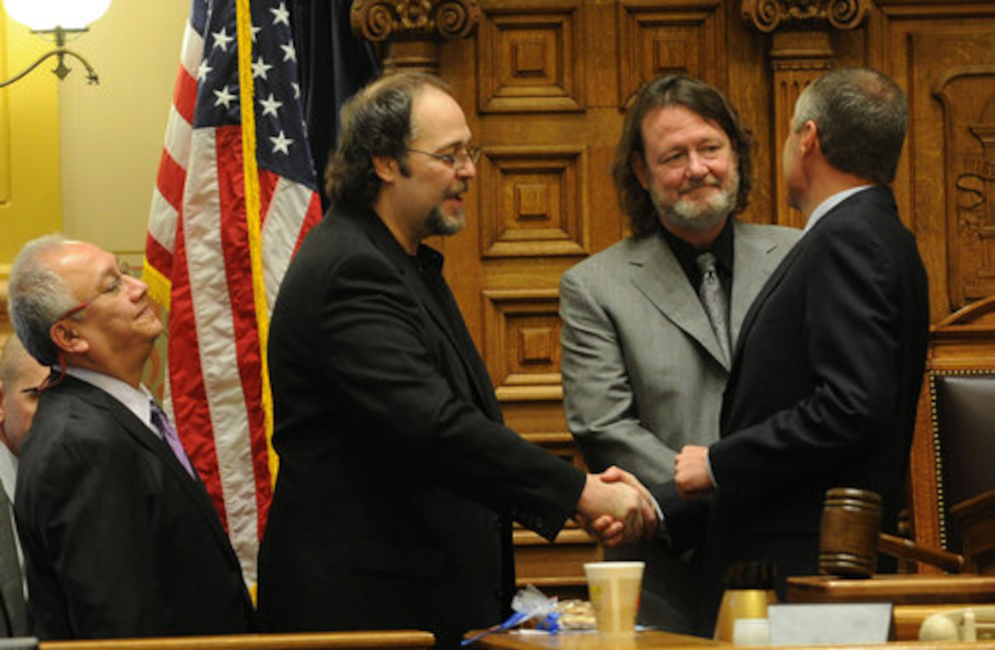Widespread Panic members Domingo Ortiz, Todd Nance and John Bell greet Georgia Lt. Gov. Casey Cagle inside the Georgia Senate on Tuesday, Feb 15, 2011.