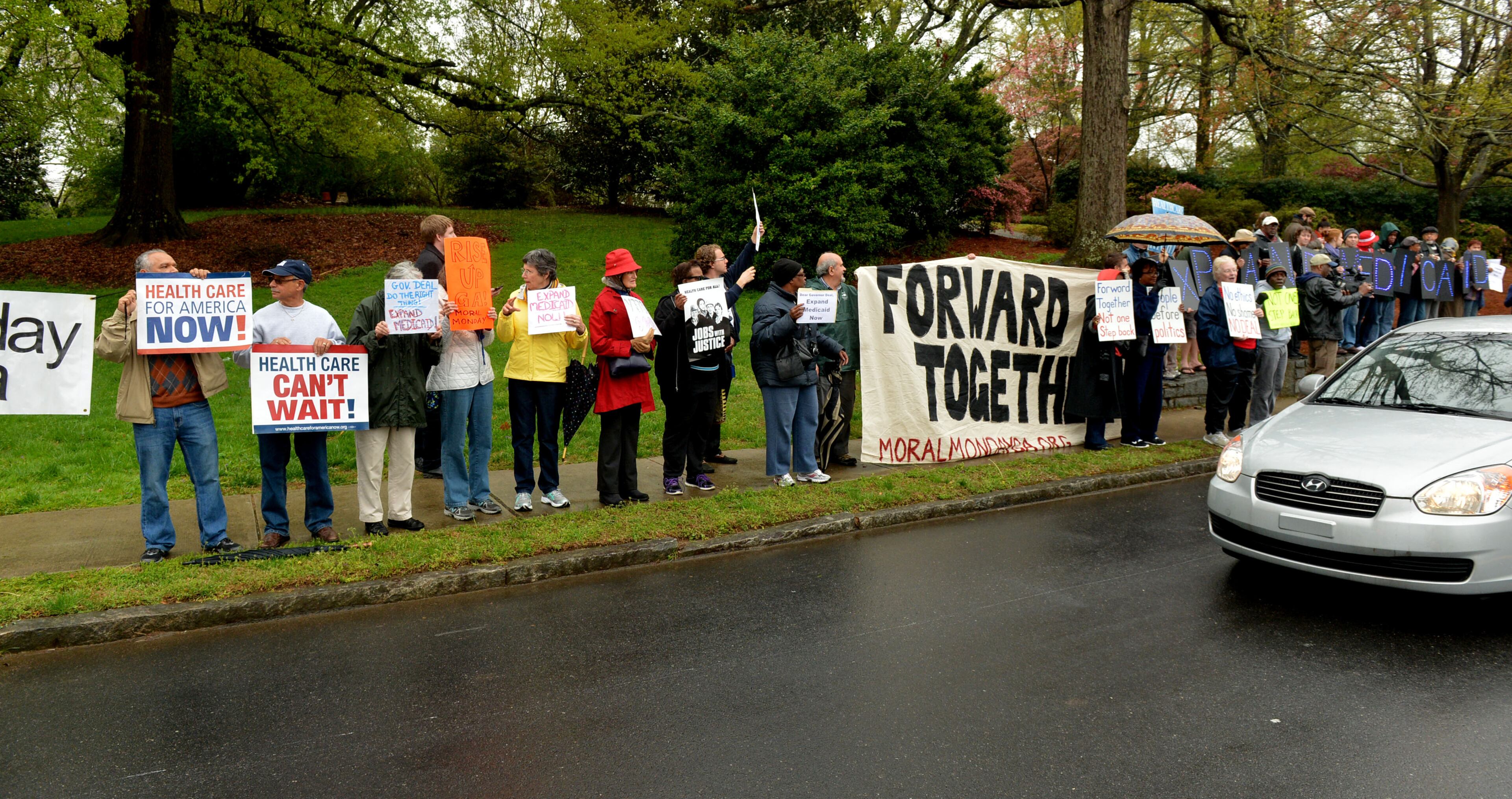 Protesters were calling on Gov. Nathan Deal to expand Medicaid services in the state. KENT D. JOHNSON / KDJOHNSON@AJC.COM