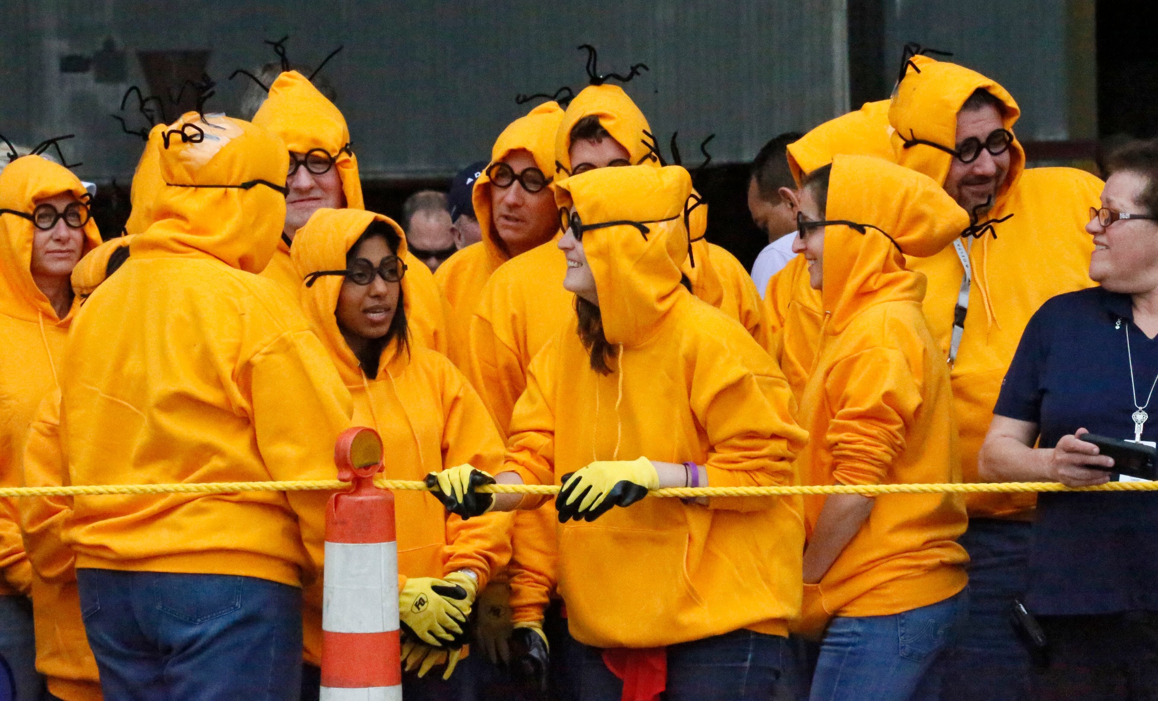 Many teams devised uniforms, like the Safety Crusader Minions, which are waiting for their turn at the rope.