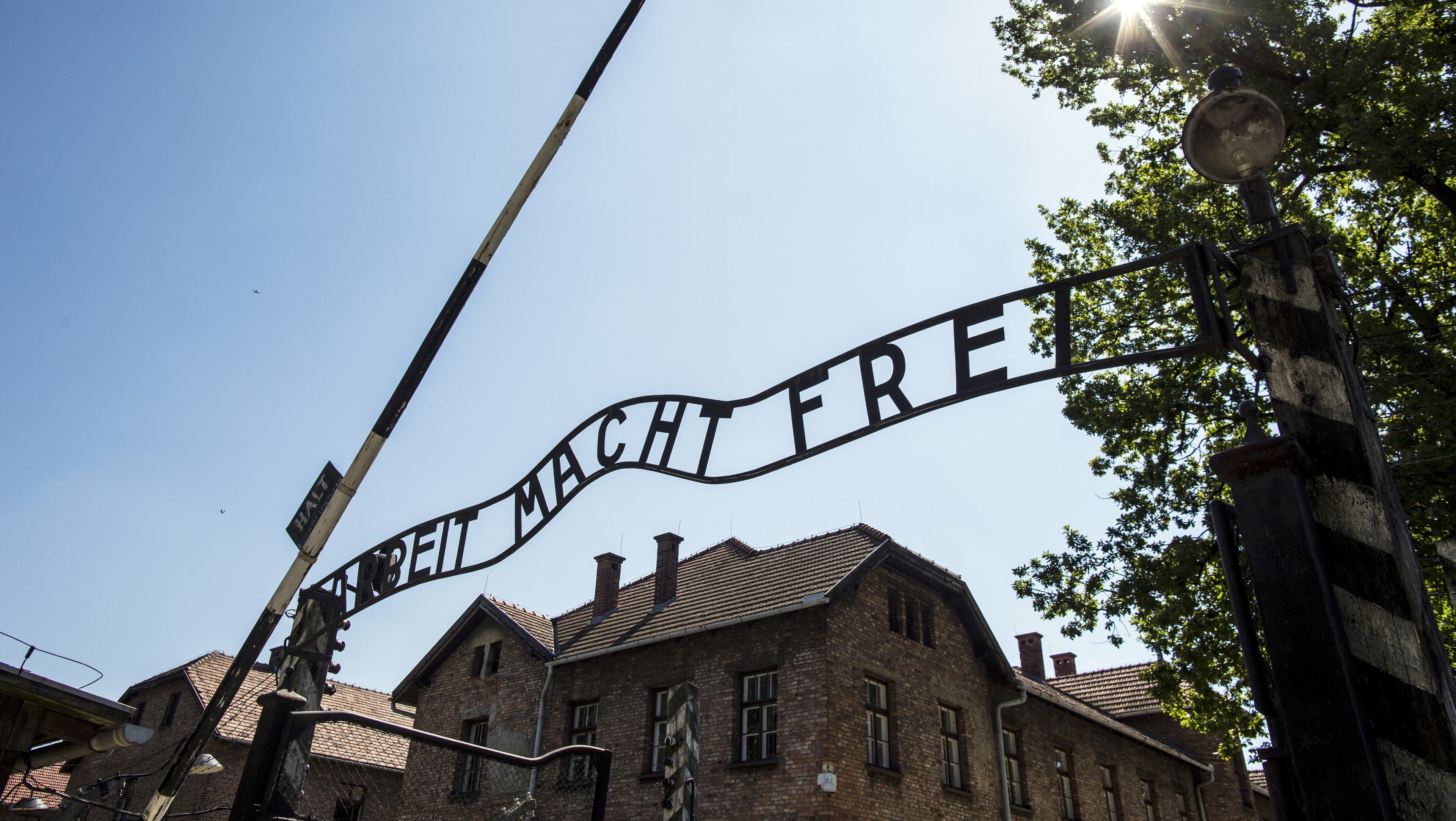 The entrance to the Auschwitz-Birkenau State Museum in Poland. A writer and his sister journey to the childhood homes of their Polish parents, places where once Jews like them could thrive. (Daniel Rodrigues/The New York Times)