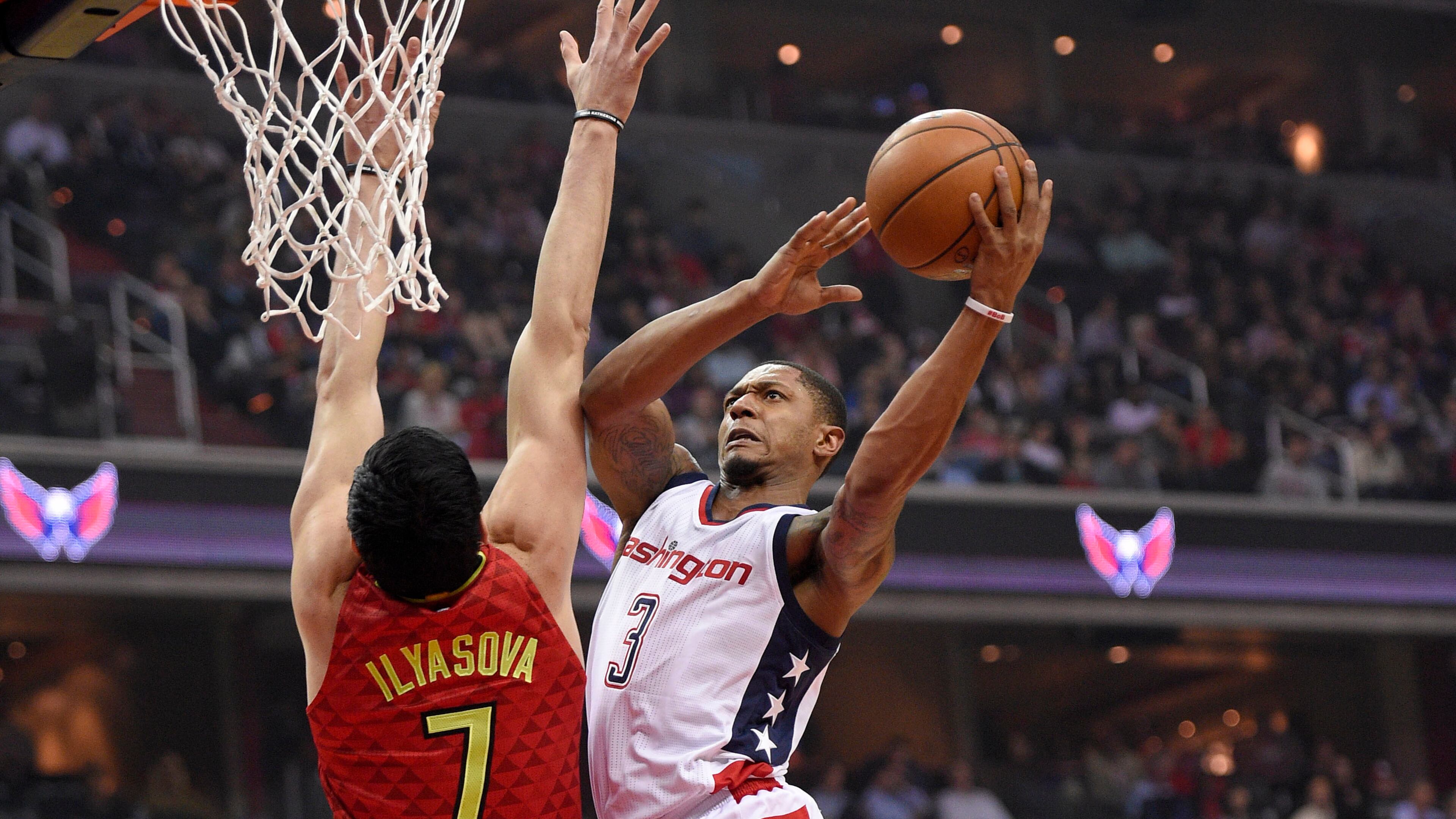 Wizards guard Bradley Beal goes to the basket against Hawks forward Ersan Ilyasova during the first half in Game 5 of a first-round NBA basketball playoff series, Wednesday, April 26, 2017, in Washington. (AP Photo/Nick Wass)