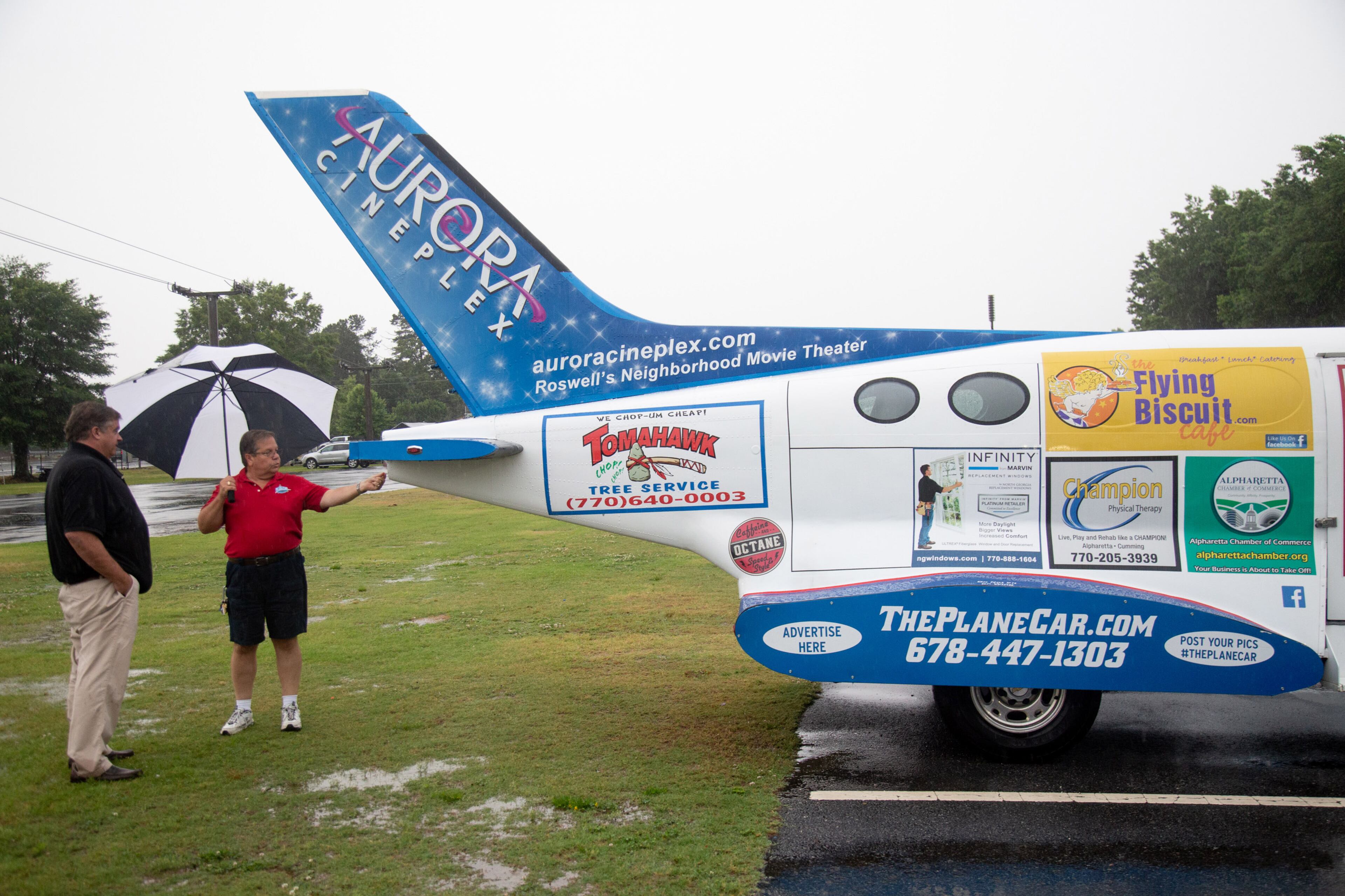 Tripp Rabalais (L) talks with Mark Rax about Rax's half truck and half plane creation during the Creepers Car Club’s 29th annual charity show in Marietta on Sunday, June 8, 2019. STEVE SCHAEFER / SPECIAL TO THE AJC
