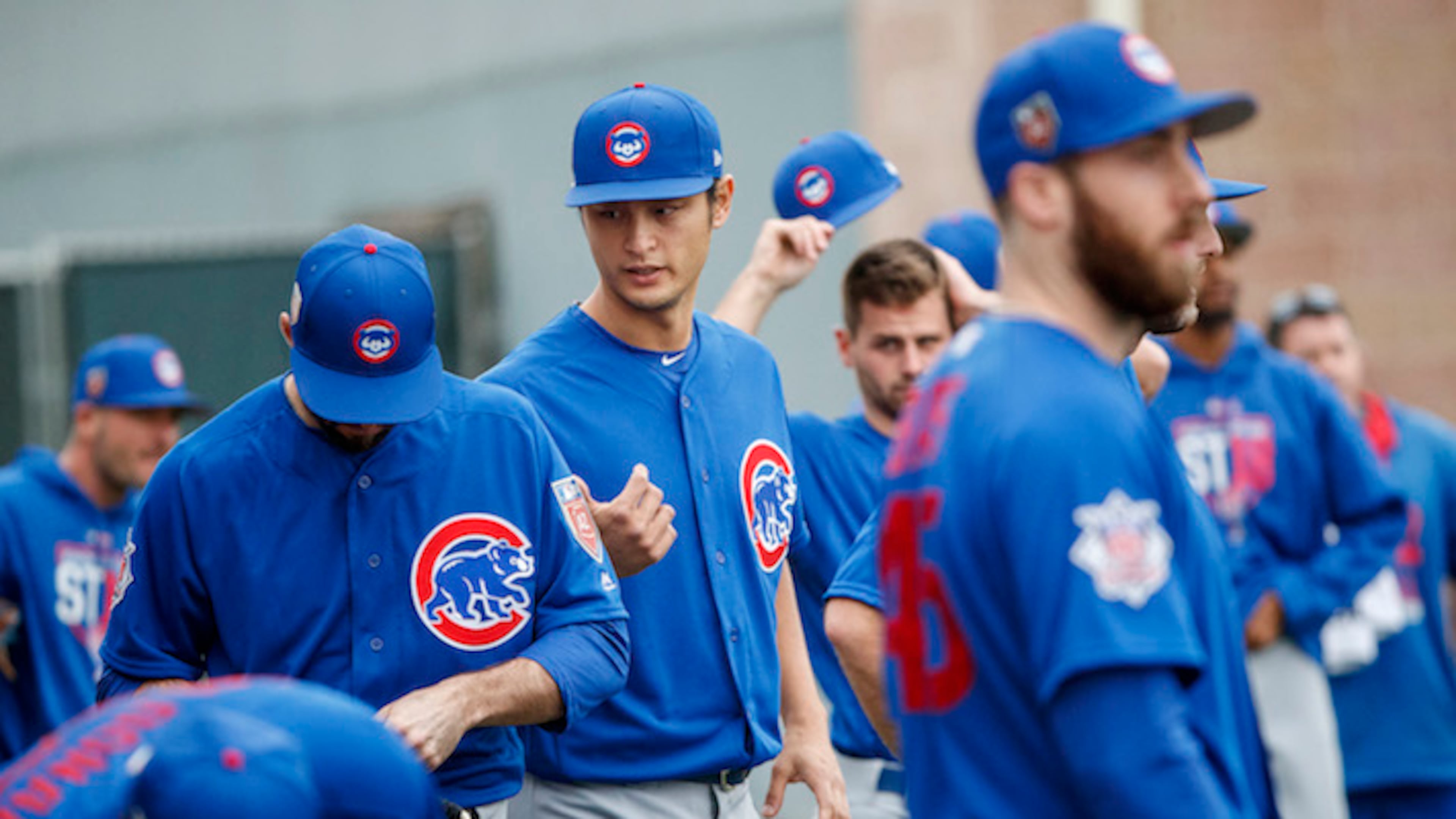 Chicago Cubs pitcher Yu Darvish talks with other players during the first day of pitchers and catchers practice at Sloan Park during Cubs spring training Wednesday Feb. 14, 2018, in Mesa, Ariz. (Armando L. Sanchez/Chicago Tribune/TNS)