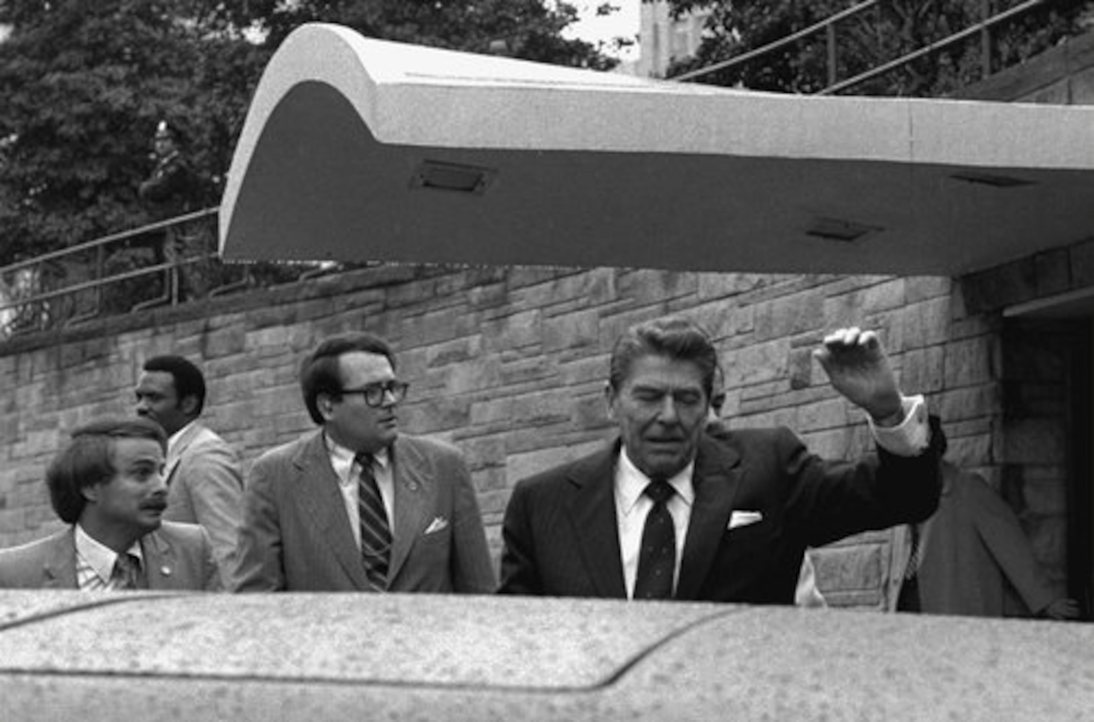 ** FILE ** U.S. President Ronald Reagan winces and raises his left arm as he was shot by an assailant as he left a Washington hotel, in this March 30, 1981 file photo, after making a speech to a labor group. After he was seriously wounded in a 1981 assassination attempt, Reagan described the experience simply in one of his presidential diaries: "Getting shot hurts." Secret Service agent Ray Shaddick is at bottom left.
