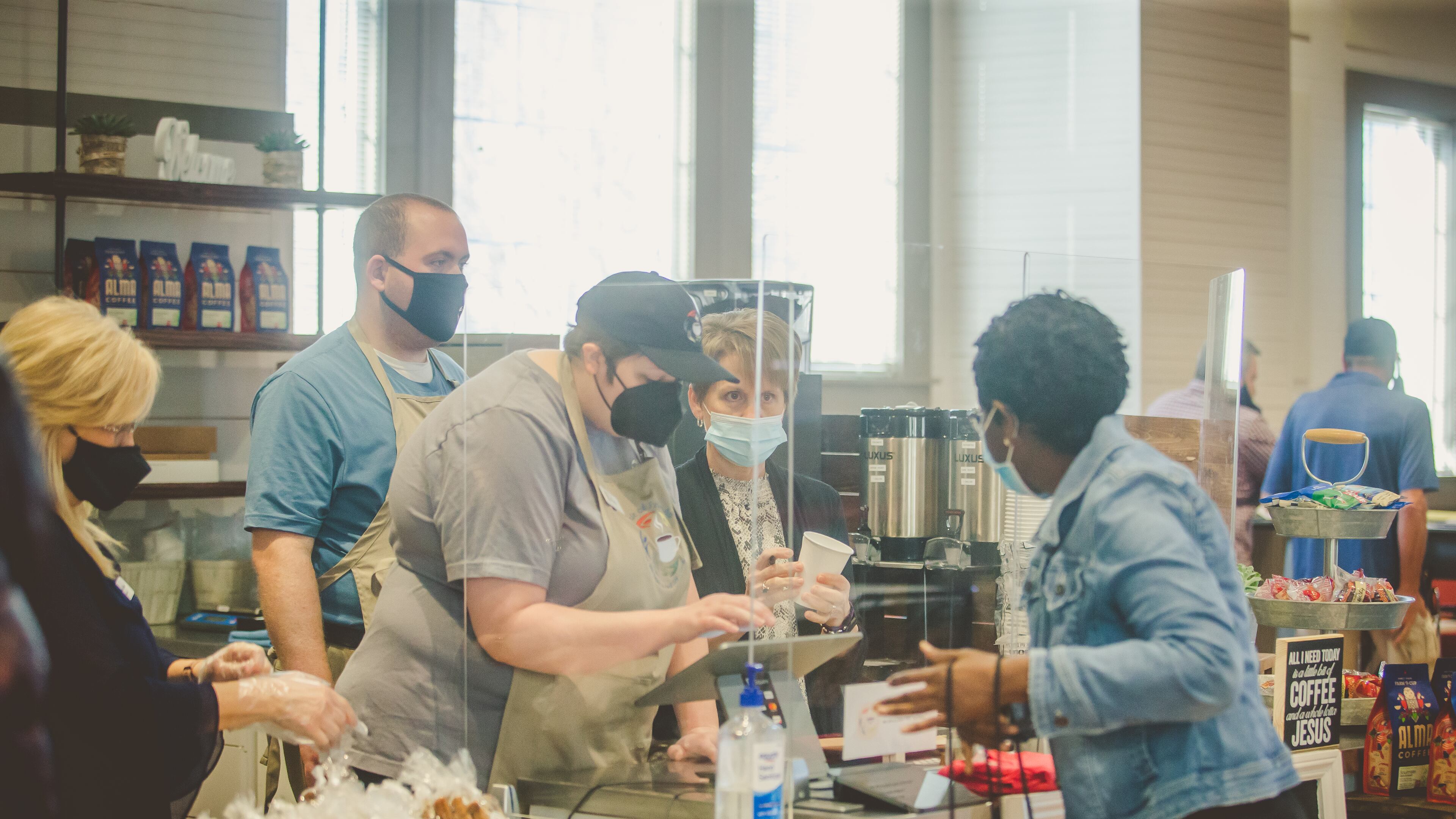 Circle of Friends recently opened a coffee shop inside 'The Circuit' serving Cherokee-based Alma Coffee, along with other drinks and offerings (L to R: Diane Keen, co-founder; KC, Barista; Alex, cashier; Julie Wagner, volunteer coordinator and Grace Nyaga, customer).