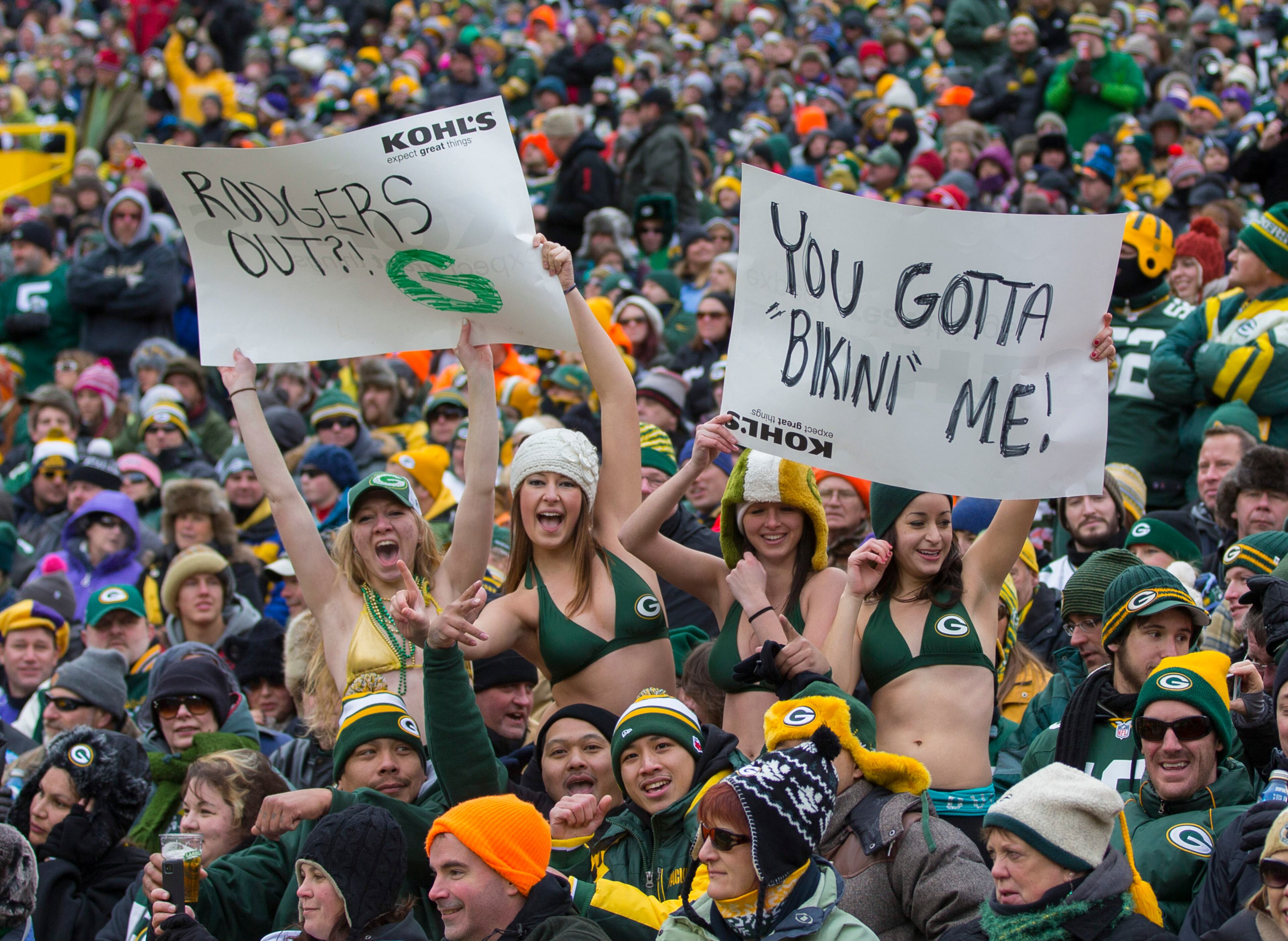 Green Bay Packers fans hold up signs supporting Aaron Rodgers (not pictured) during the second quarter against the Minnesota Vikings at Lambeau Field. The Vikings and Packers tied 26-26. Mandatory Credit: Jeff Hanisch-USA TODAY Sports