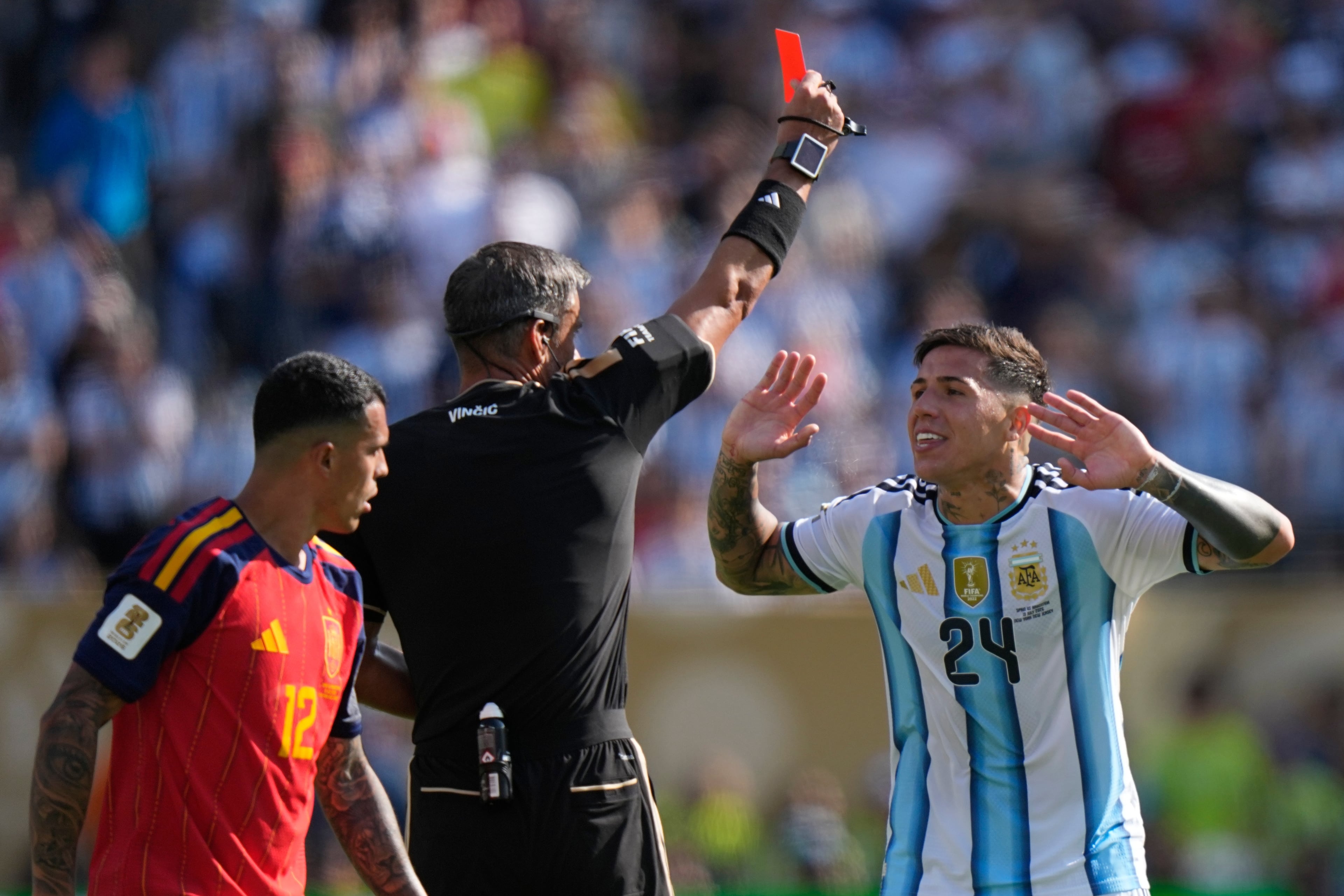 Referee Slavko Vincic of Slovenia shows a red card to Argentina's Enzo Fernandez (right) during the World Cup final soccer match between Spain and Argentina in East Rutherford, N.J., near New York, Sunday, July 19, 2026. (Frank Franklin II/AP)