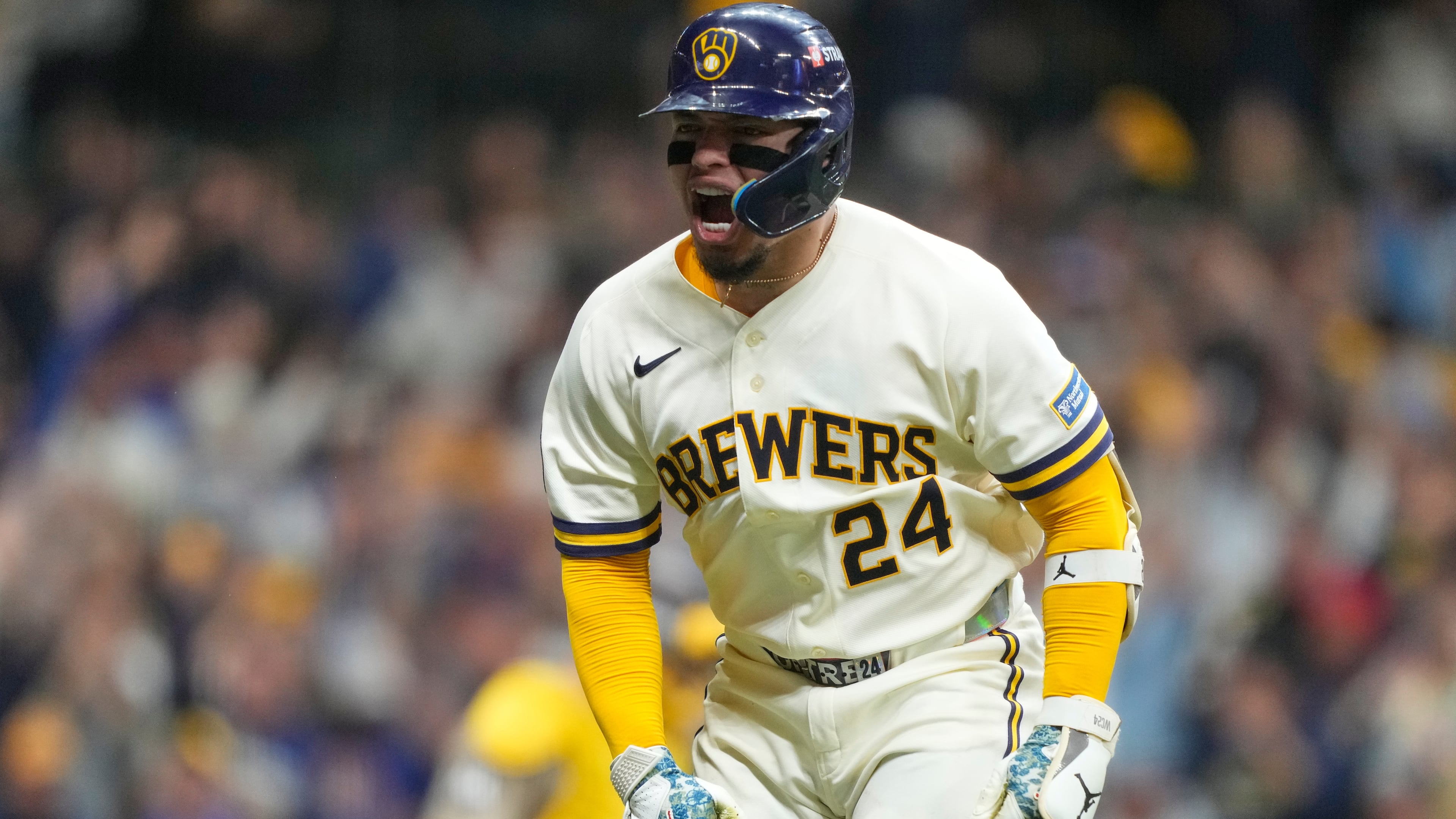 Milwaukee Brewers' William Contreras reacts after hitting a home run during the seventh inning in Game 1 of a National League Divisional baseball playoff series against the San Diego Padres Saturday, Oct. 3, 2026, in Milwaukee. (AP Photo/Kayla Wolf)
