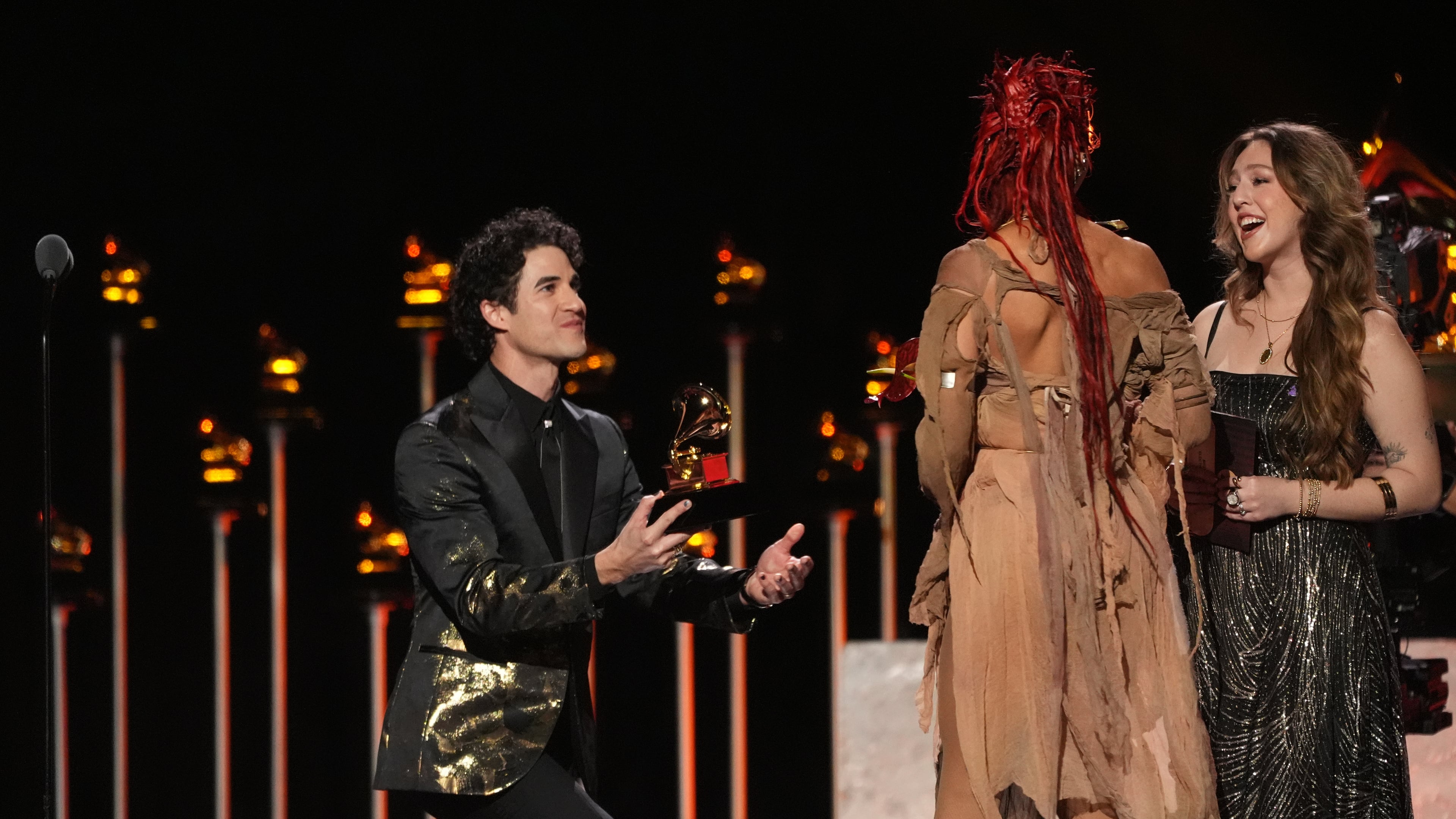Host Darren Criss, left, presents the award for best dance/electronic album to FKA Twigs for "EUSEXUA" during the 68th annual Grammy Awards on Sunday, Feb. 1, 2026, in Los Angeles. (AP Photo/Chris Pizzello)