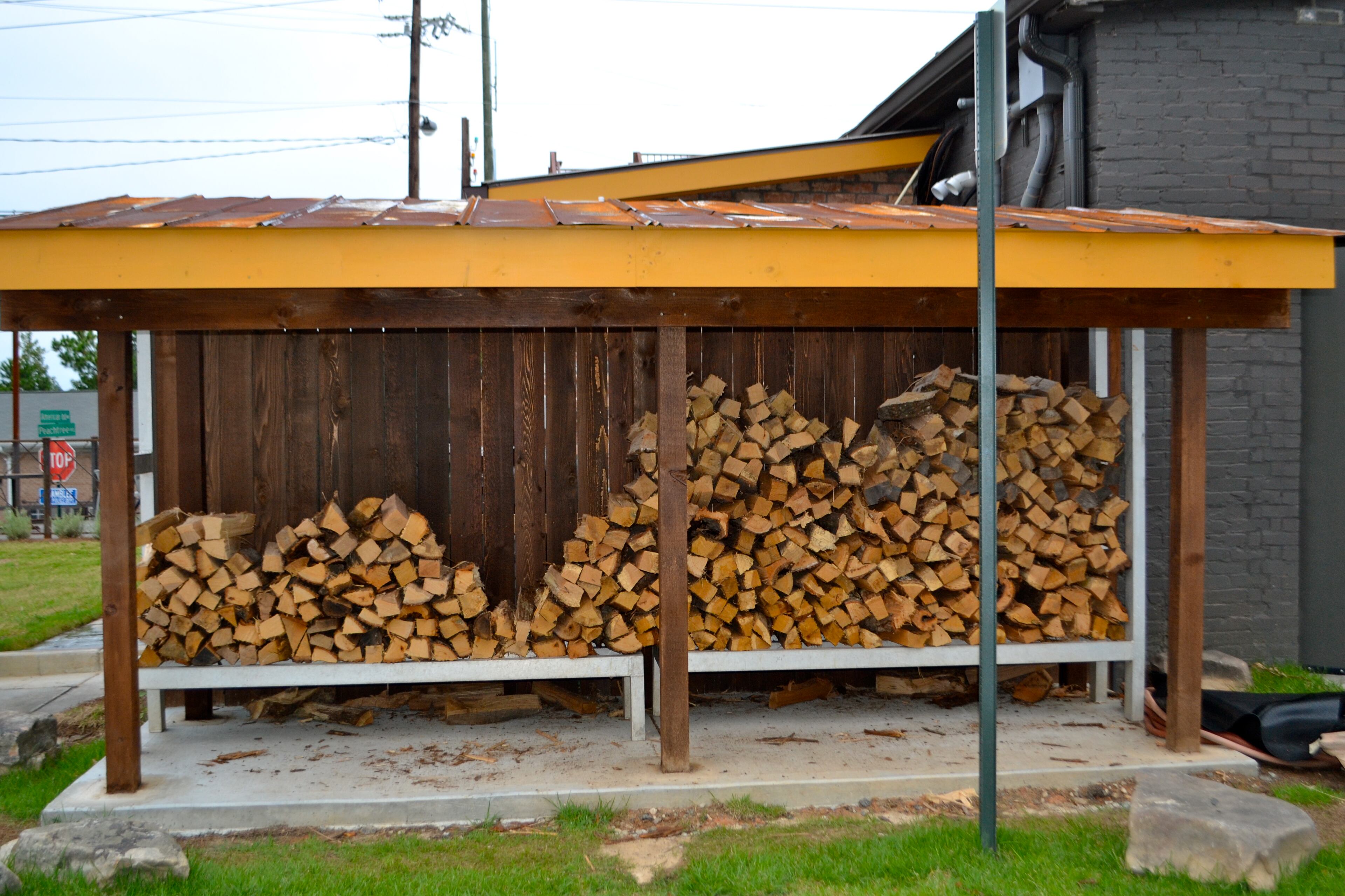 Soutbound stocks a supply of wood for it's indoor grill. The smoky aroma greets you at the door.