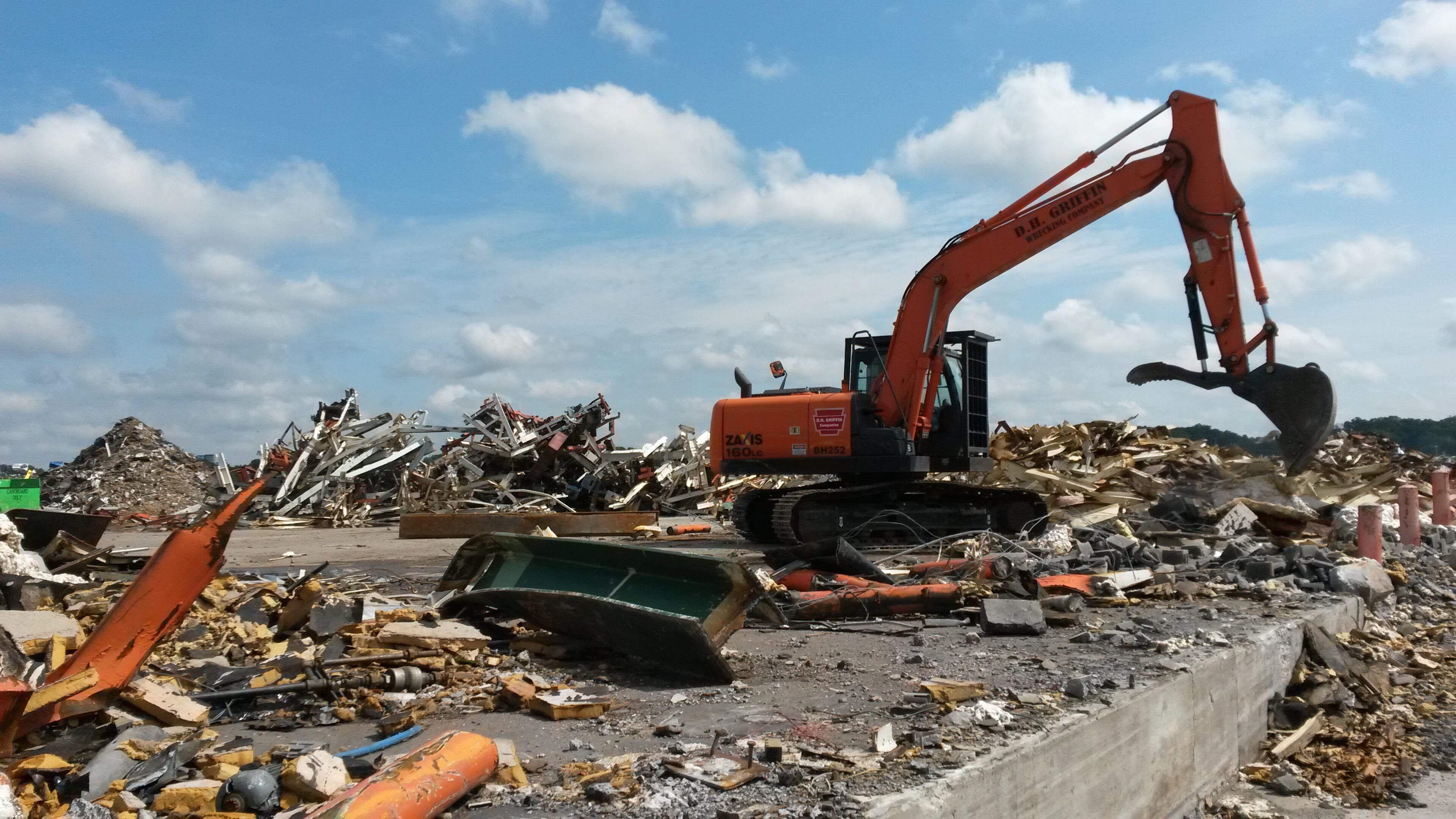 A swarm of heavy equipment being used to pick up and chew up remains of the former GM assembly plant in Doraville. Much of the scrap material is being loaded on rail cars bound for Birmingham. MATT KEMPNER / AJC