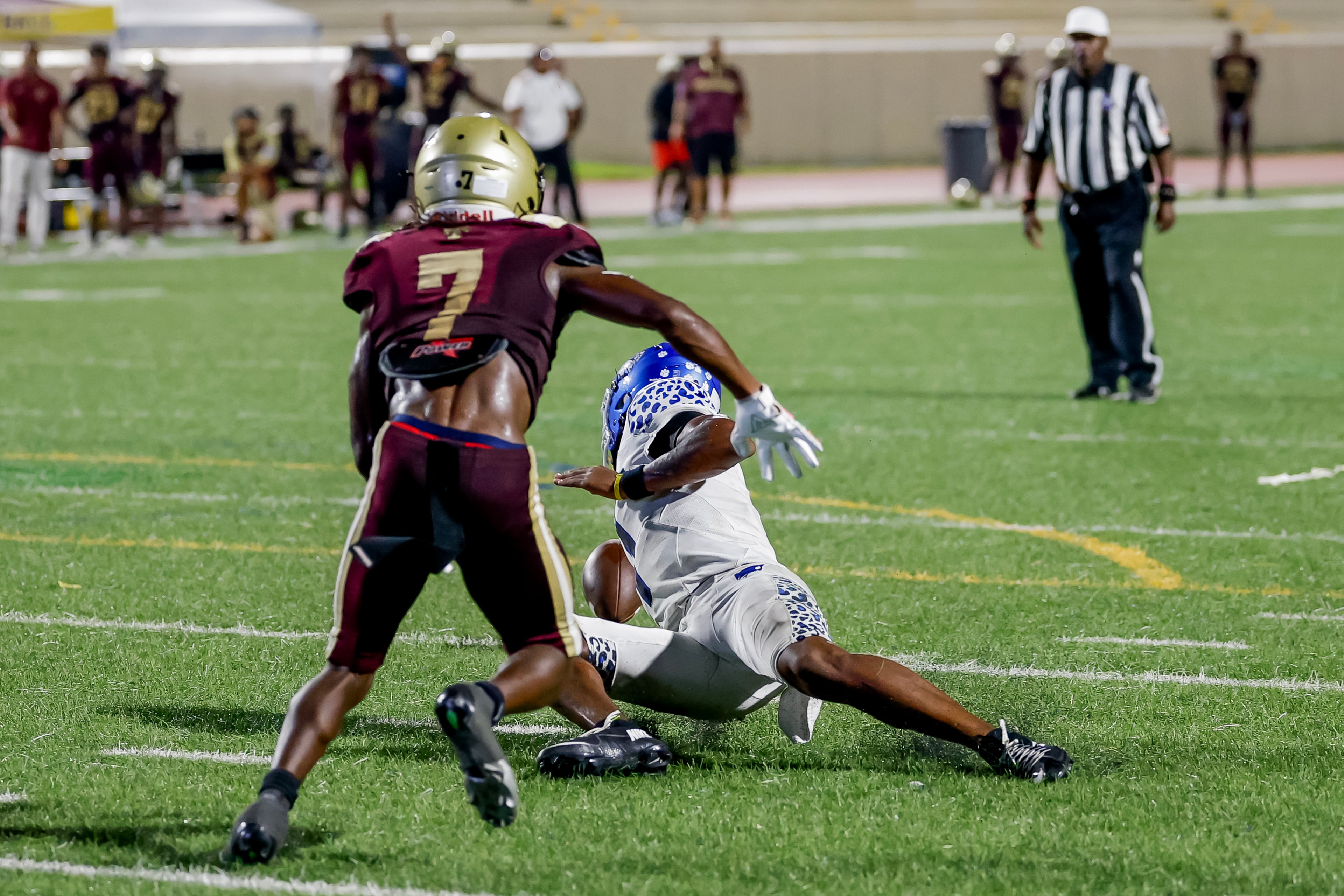 Stephenson quarterback Zabrian Boler (right) fumbles the ball against Tucker’s Tyaire Byrd late in the second half at Hallford Stadium on Friday, Sept. 4, 2026, in Clarkston. (Erik S. Lesser for the AJC)