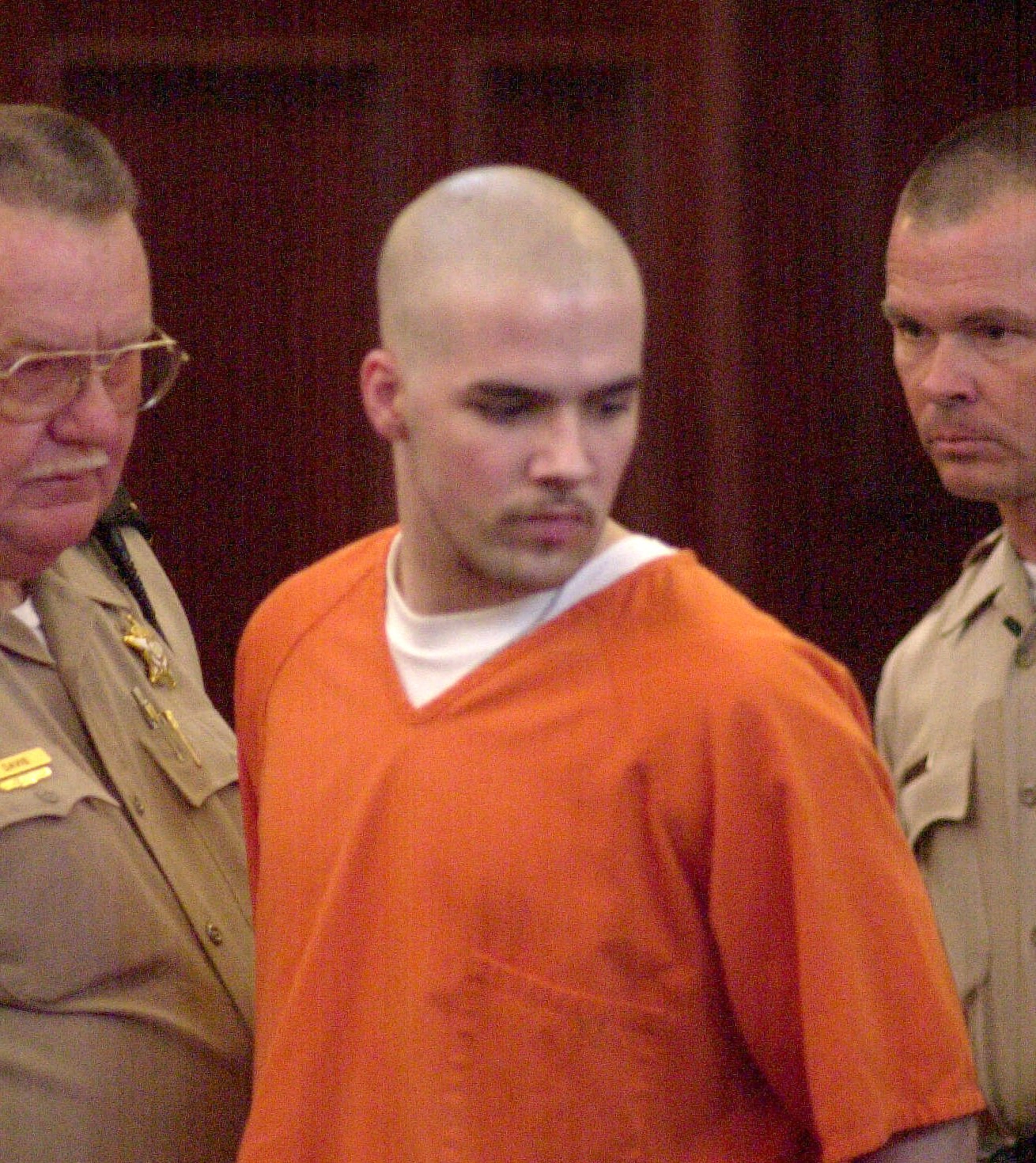 T.J. Solomon was 15 years old when he used his stepfather’s .22-caliber rifle and a .357-caliber Magnum revolver to open fire inside Heritage High School’s commons area. He was released from prison July 26, 2016, after serving 17 years of a 20-year sentence. Here, Solomon, then 17, enters a Rockdale County courtroom flanked by Rockdale Sheriff's deputies in Conyers, Aug. 9, 2001. He was seeking a reduction of his 40-year prison sentence. Read more about Solomon's release here. -- Text by Lauren Foreman, AJC