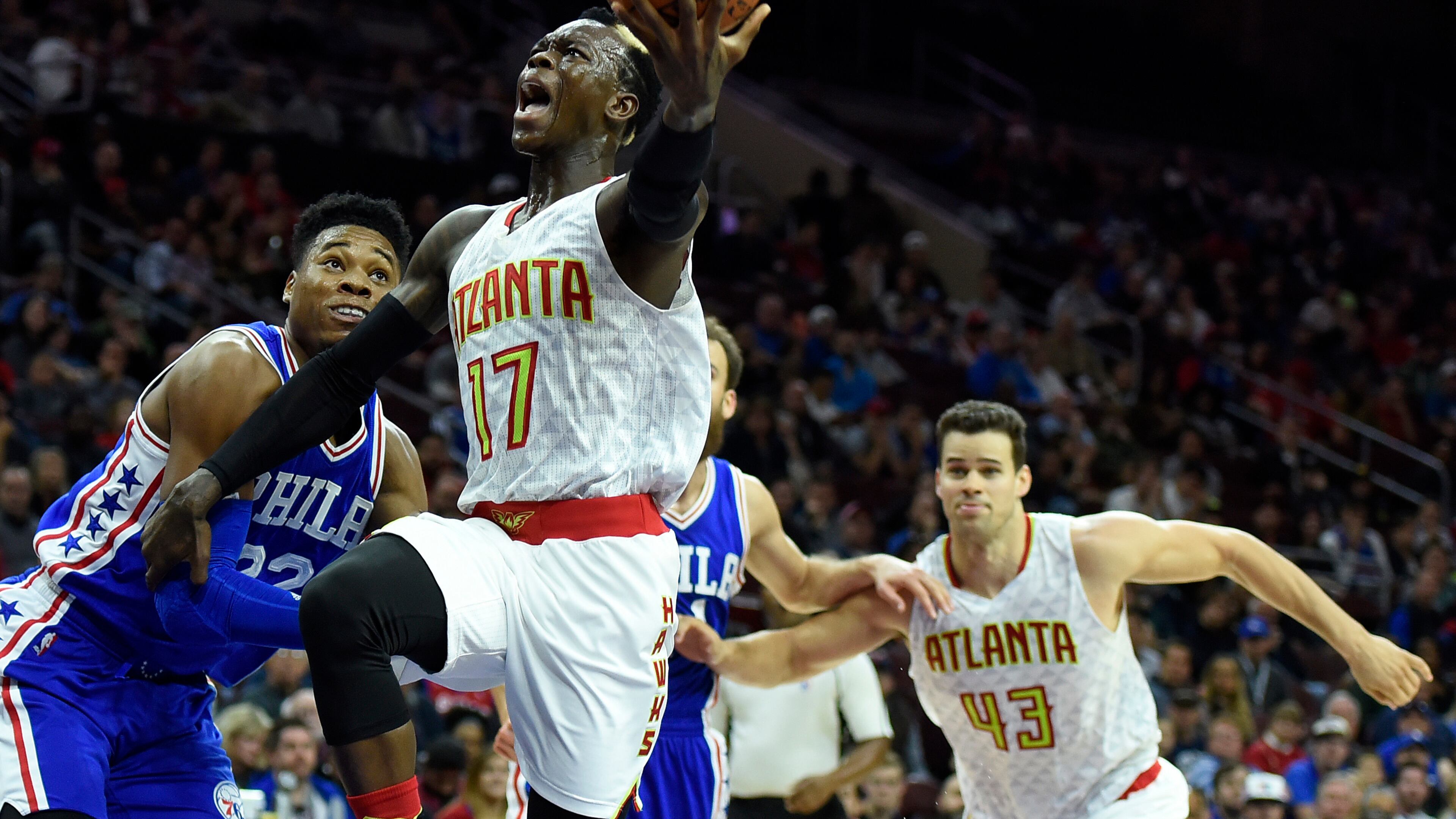 Atlanta Hawks’ Dennis Schroder (17) drives to the basket past Philadelphia 76ers’ Richaun Holmes (22) during the first half of an NBA basketball game, Saturday, Oct. 29, 2016, in Philadelphia. (AP Photo/Michael Perez)
