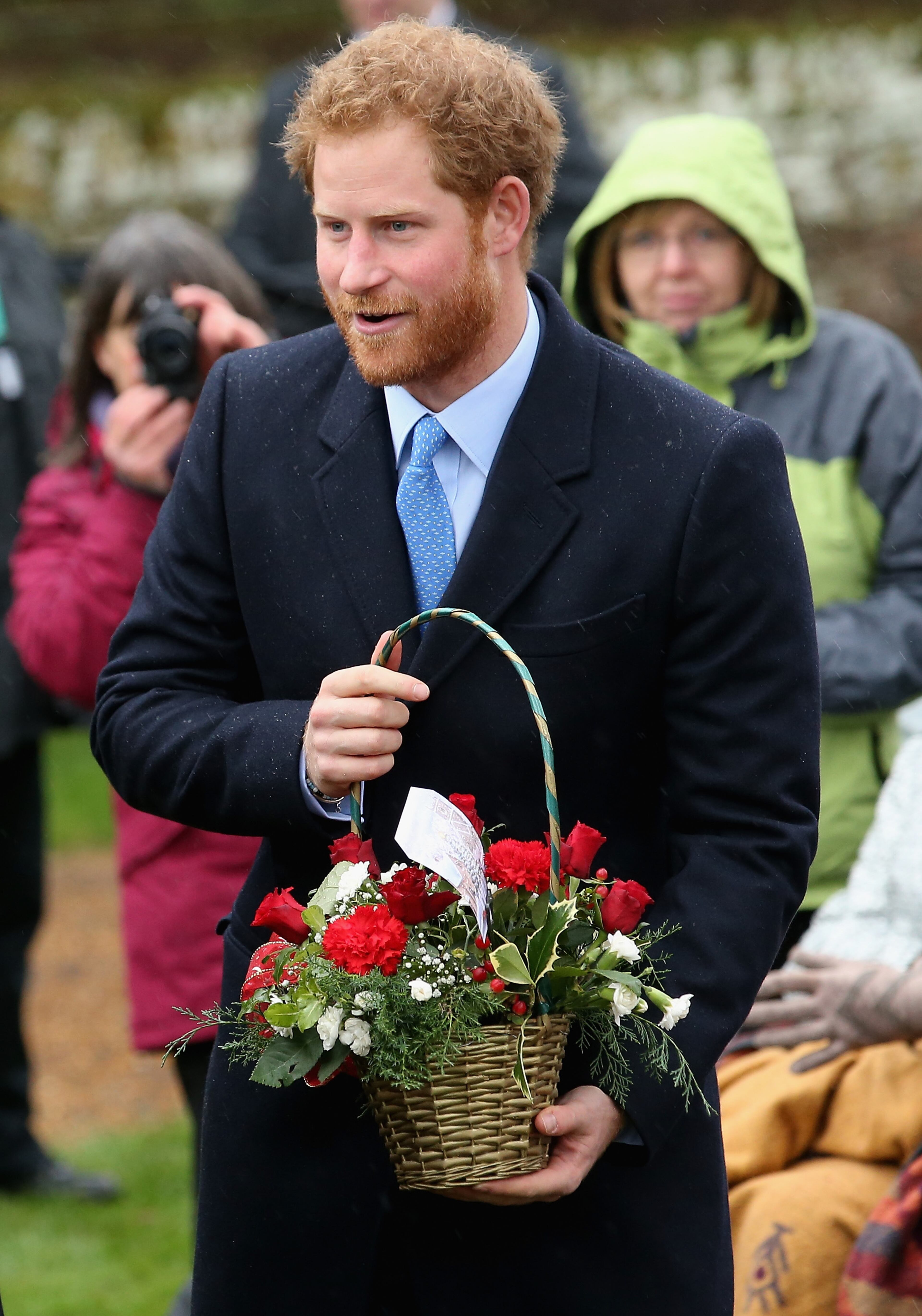 KING'S LYNN, ENGLAND - DECEMBER 25: Prince Harry meets members of the public as he attends a Christmas Day church service at Sandringham on December 25, 2015 in King's Lynn, England. (Photo by Chris Jackson/Getty Images)