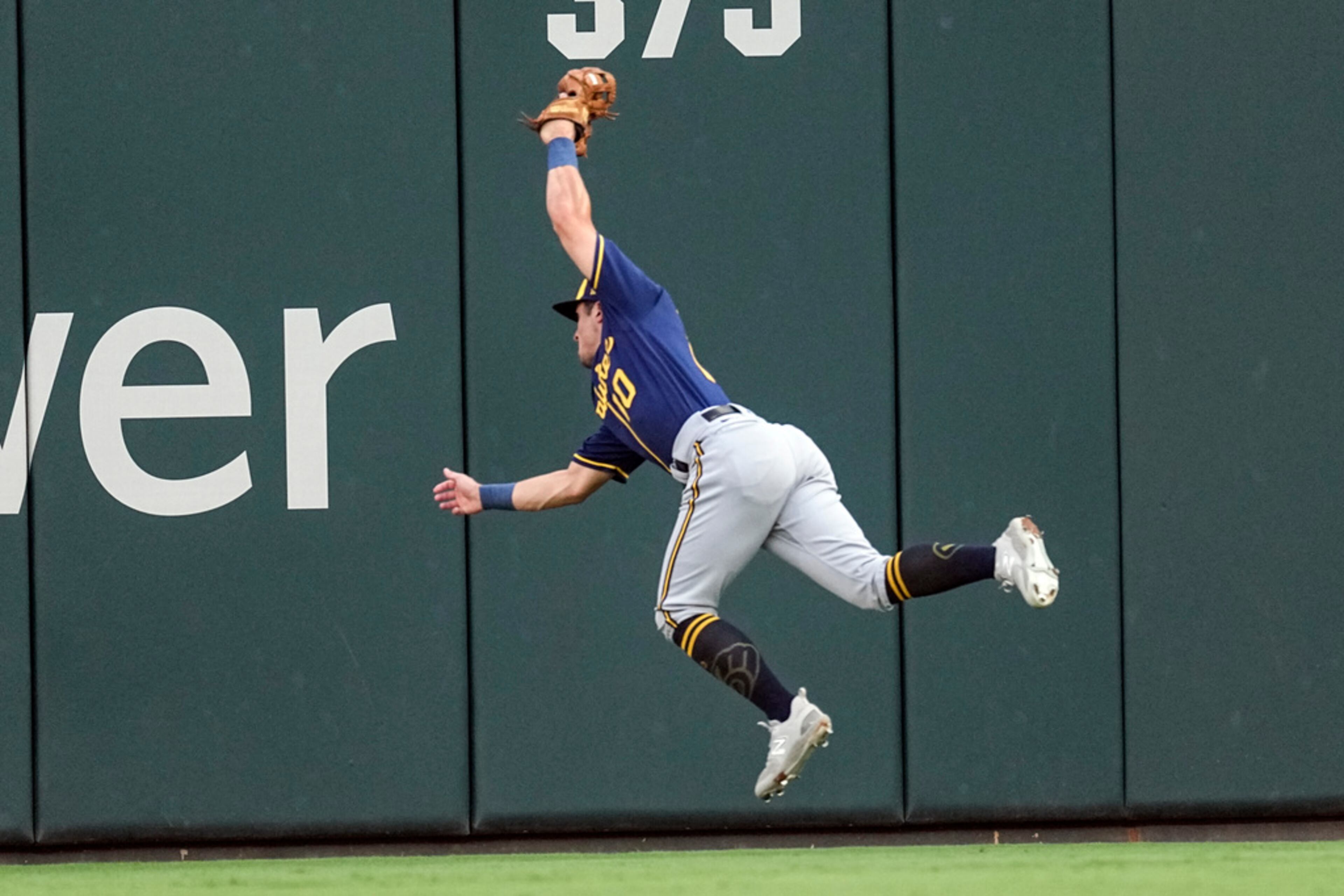 Milwaukee Brewers right fielder Sal Frelick catches a fly ball from Atlanta Braves' Travis d'Arnaud in the first inning of a baseball game Saturday, July 29, 2023, in Atlanta. (AP Photo/John Bazemore)