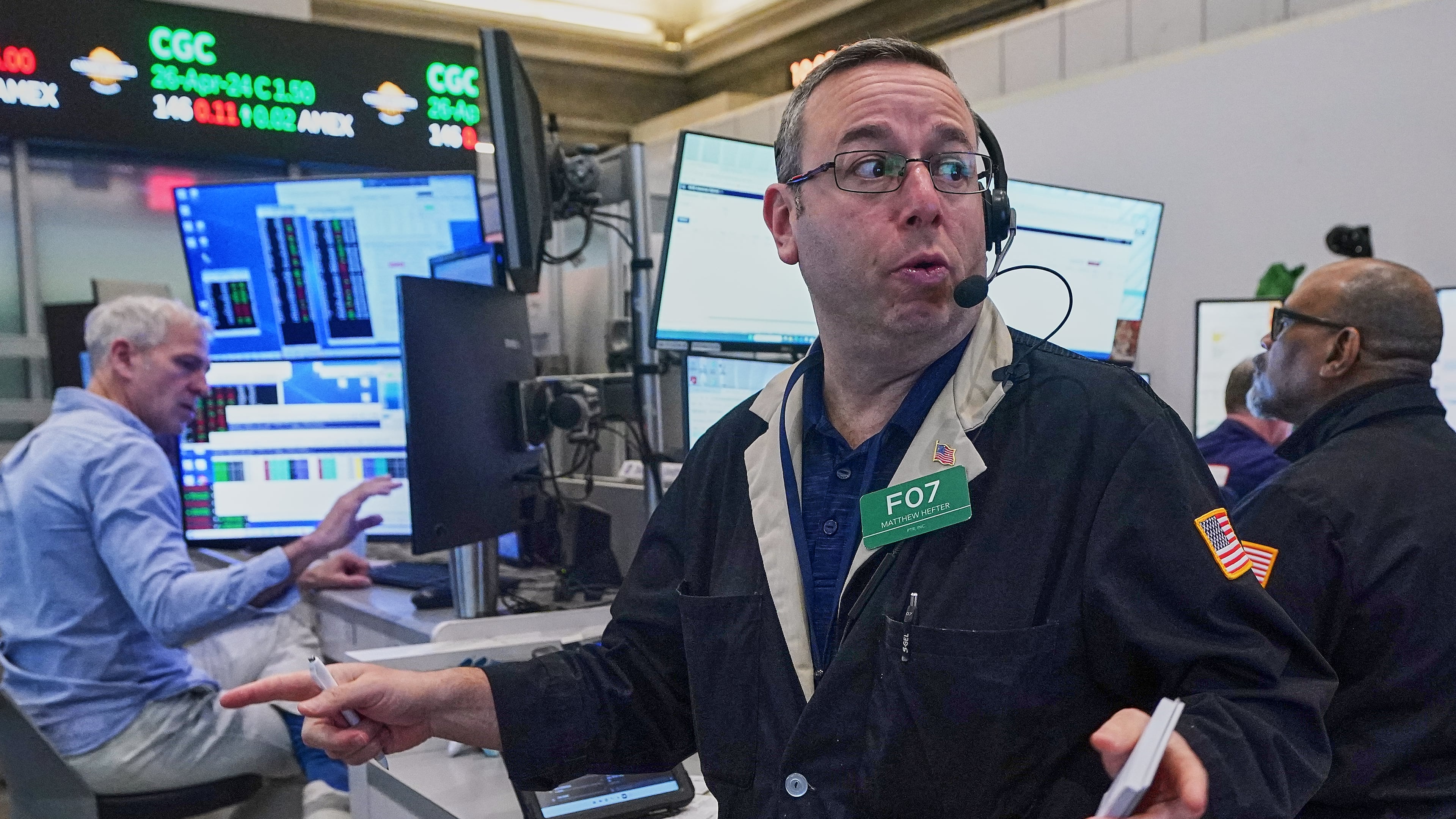 Options trader Matthew Hefter, center, works on the floor of the New York Stock Exchange, Thursday, April 23, 2026. (AP Photo/Richard Drew)