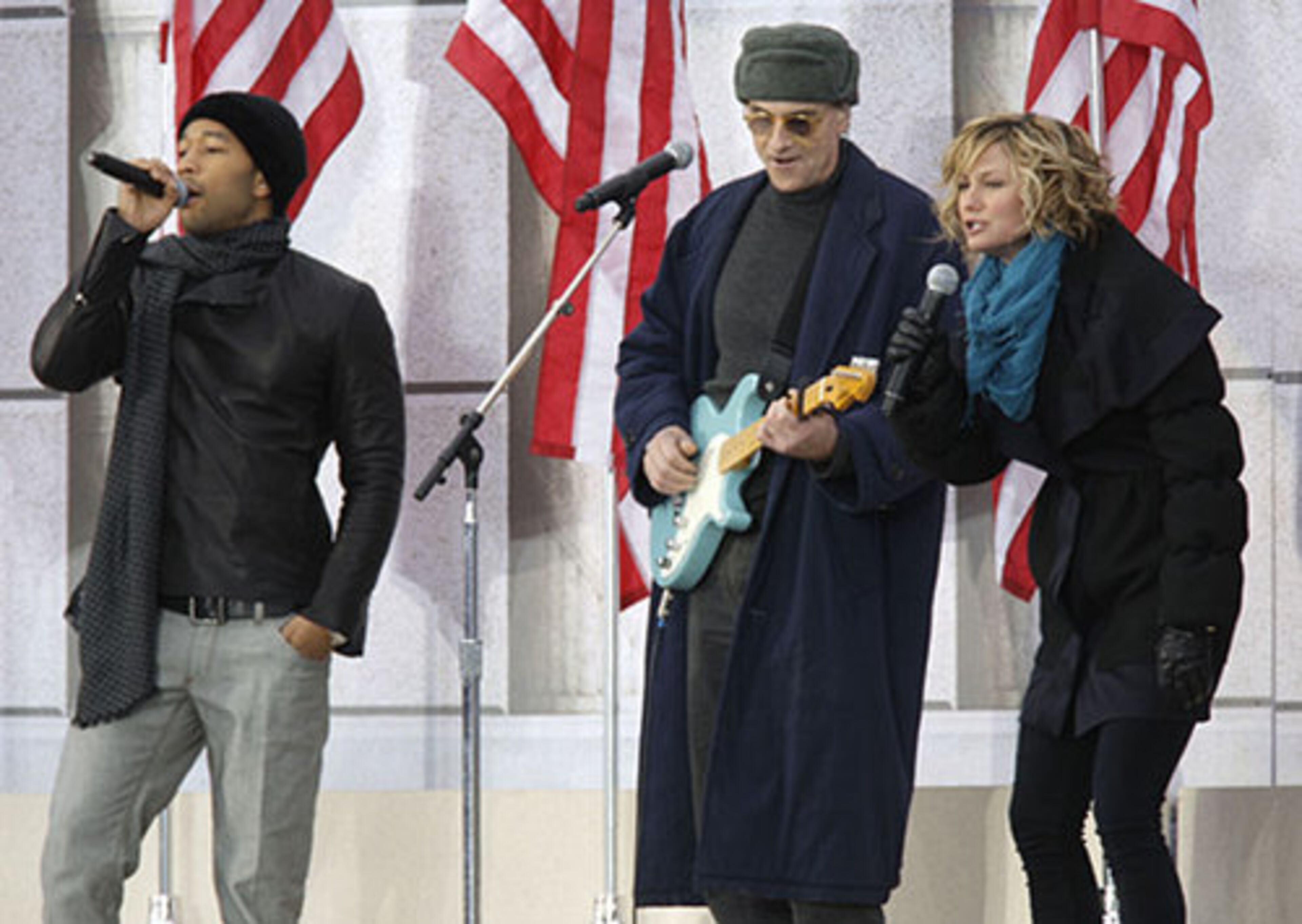 Atlanta country music star Jennifer Nettles of Sugarland performs with John Legend, left, and James Taylor, center.