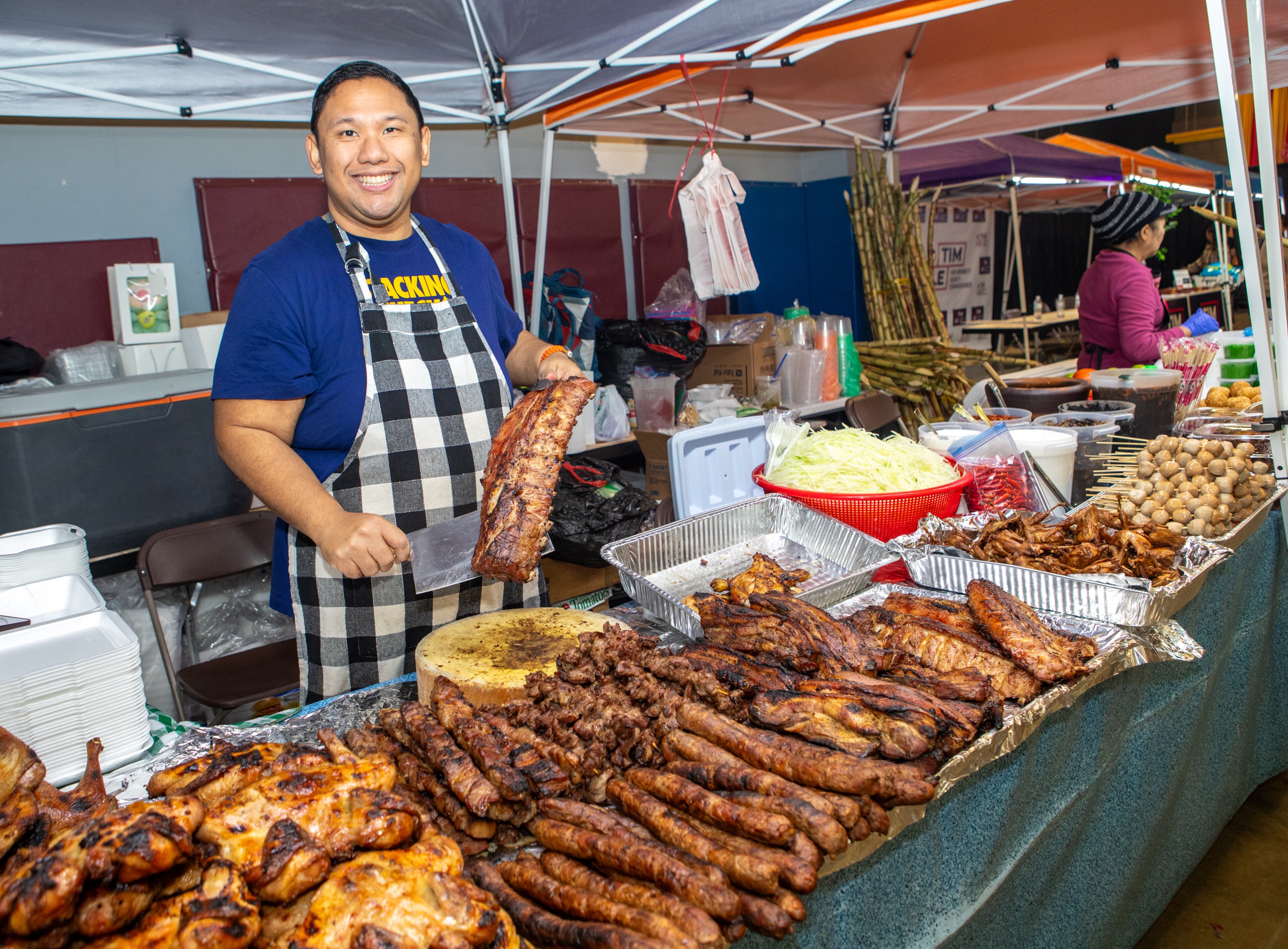 Jack K’tayong shows off his ribs as the festivities of the Lunar New Year begin on Saturday, Feb 3, 2024. The Vietnamese American Community of Georgia hosts the celebration at Plaza Las Americas in Lilburn where dragon and lion dancing, firecrackers and drumming opened the weekend. The celebration continues on Sunday and includes traditional food, music and cultural festivities. (Jenni Girtman for The Atlanta Journal-Constitution)