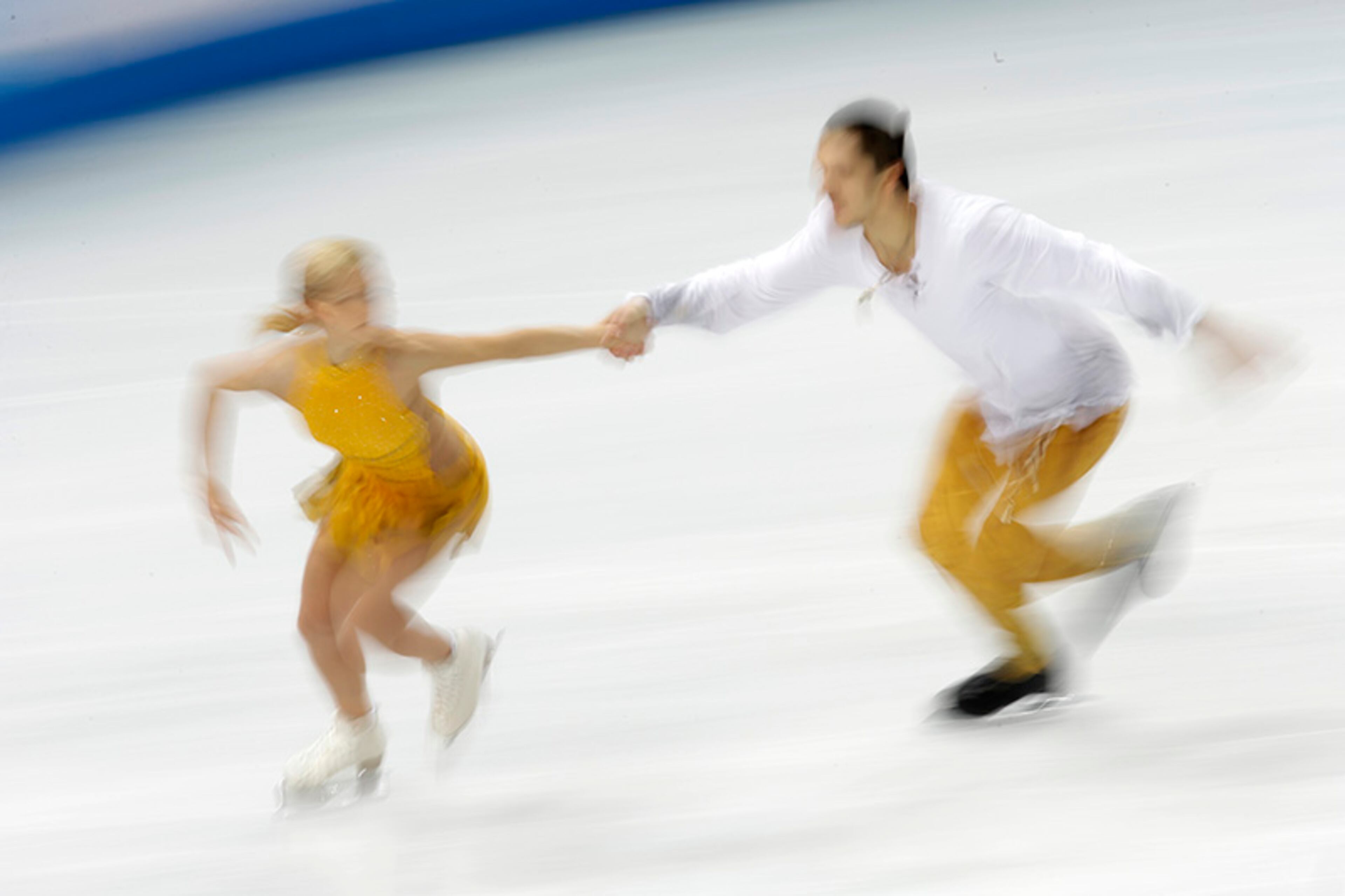 Tatiana Volosozhar and Maxim Trankov of Russia compete in the pairs free skate figure skating competition at the 2014 Winter Olympics, Wednesday, Feb. 12, 2014, in Sochi, Russia.