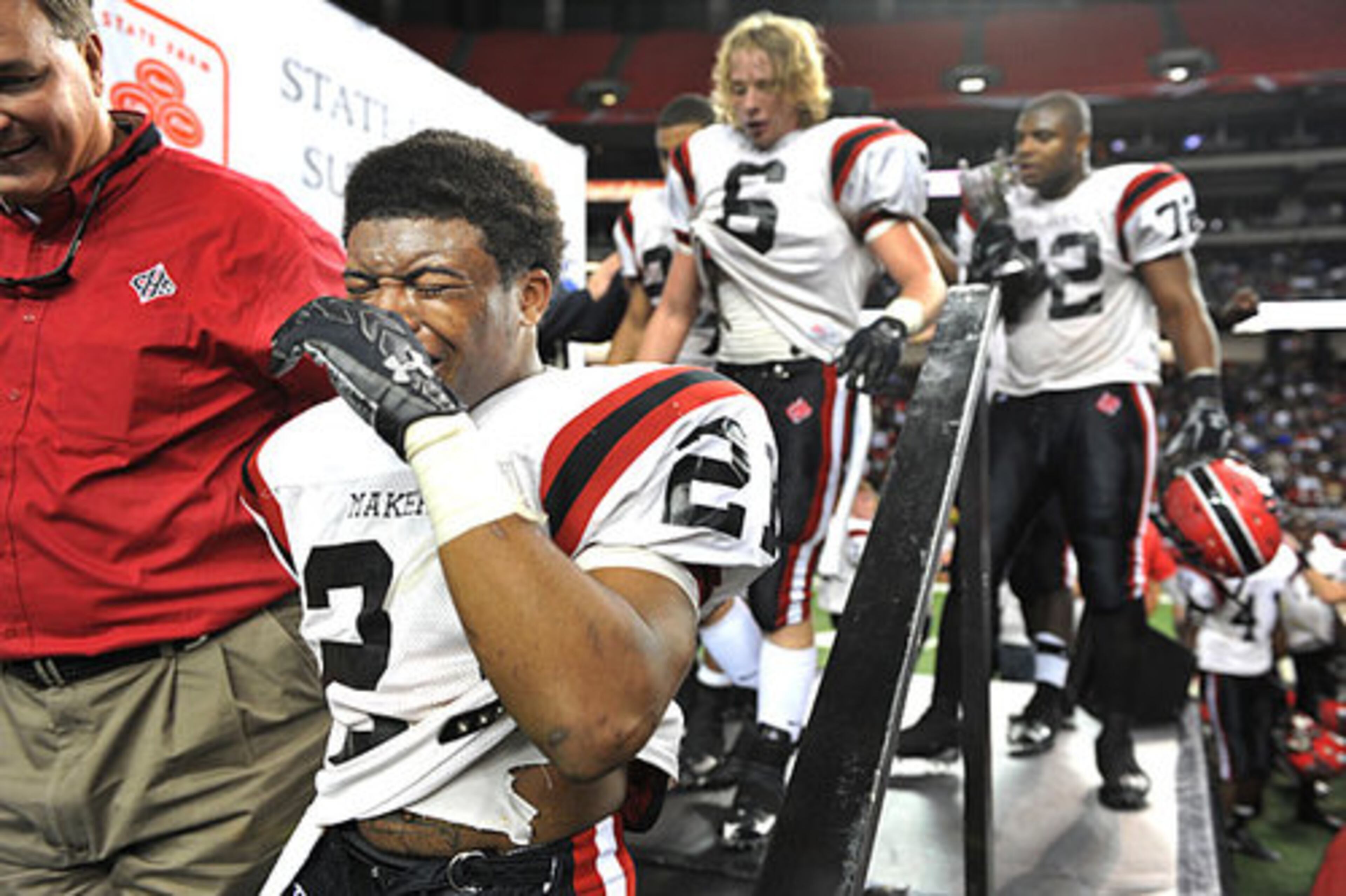 Cairo's Ronnie Wooten (21) is overcome with emotion after the Syrupmakers' victory.
