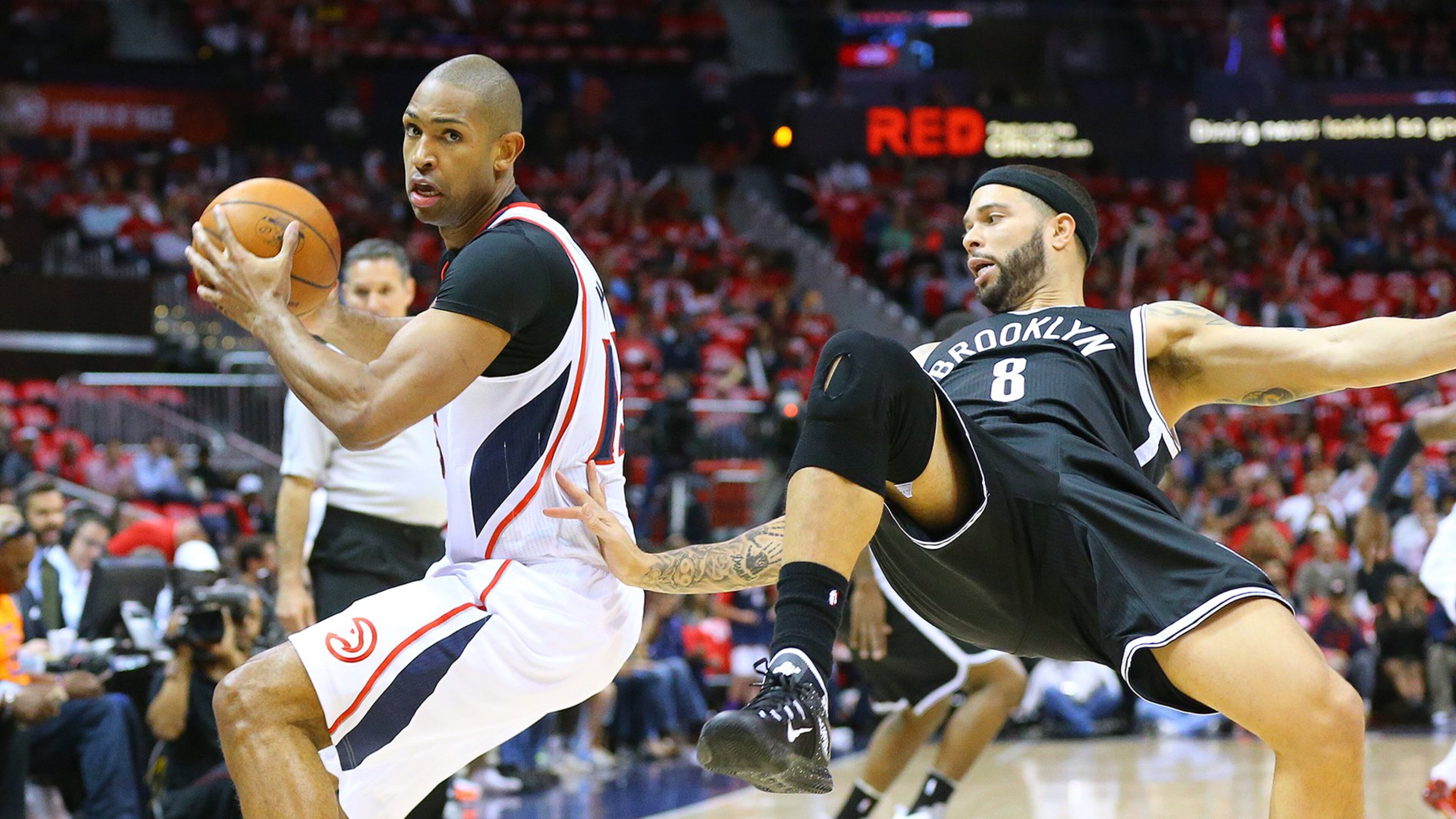 Hawks center Al Horford steals the ball from Nets guard Deron Williams during Game 5 of their playoff series Wednesday. The Hawks won 107-97 and take a 3-2 lead in series.