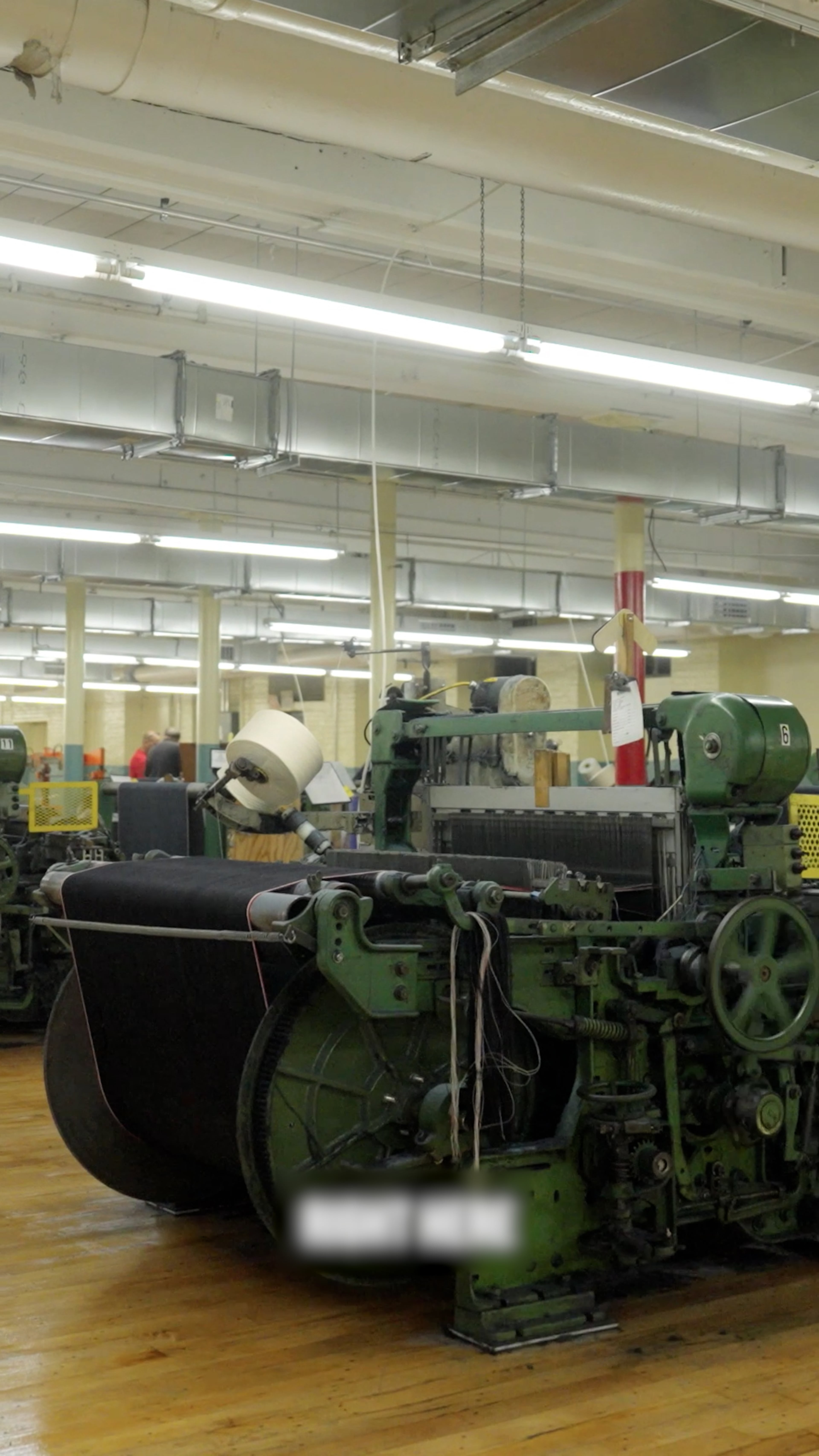 Wish we had a better photo, but this is one of the cool machines that make selvedge denim. (AJC)