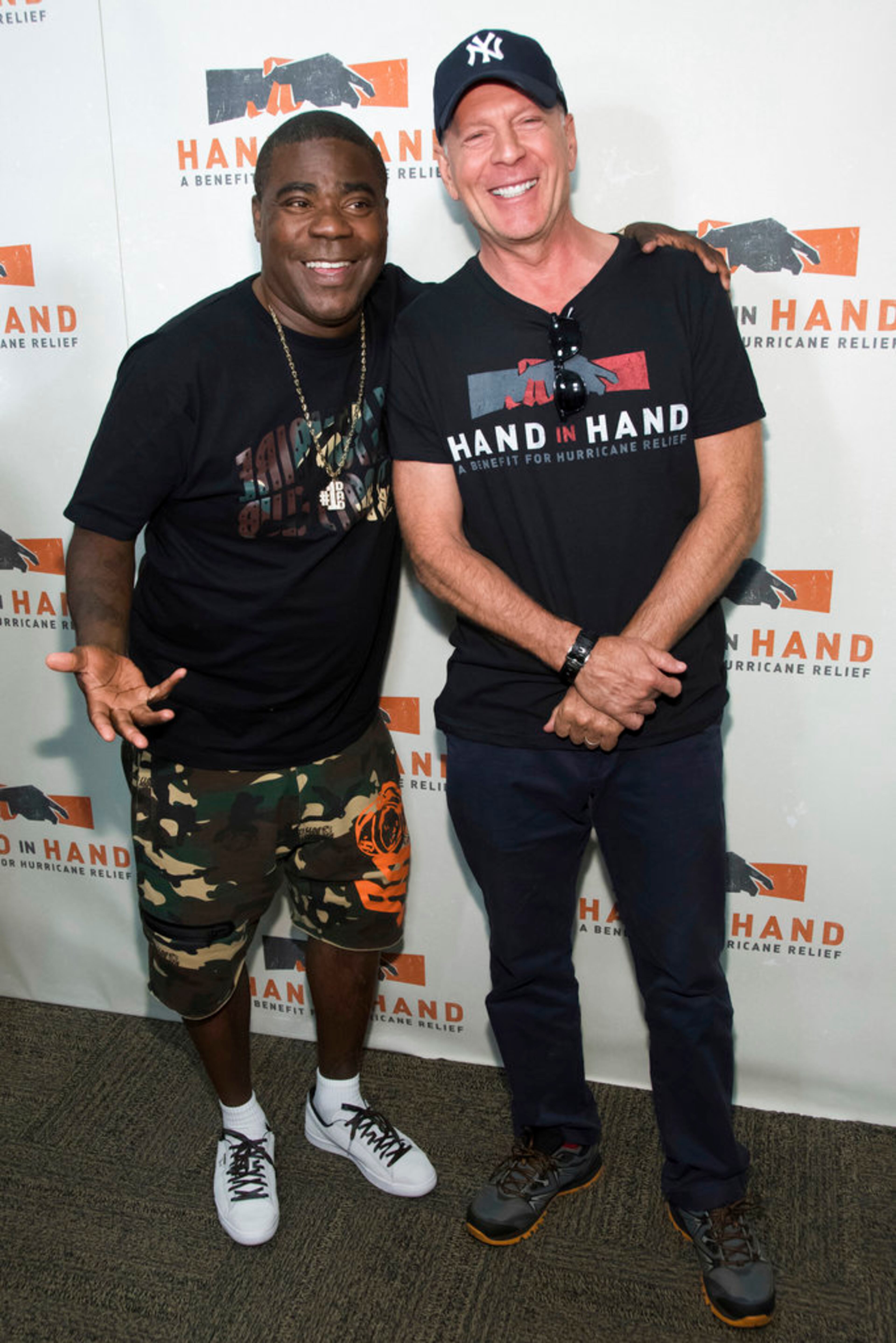 Tracy Morgan, left, and Bruce Willis attend Hand in Hand: A Benefit for Hurricane Harvey Relief at ABC Studios on Tuesday Sept. 12, 2017 in New York. (Photo by Charles Sykes/Invision/AP)