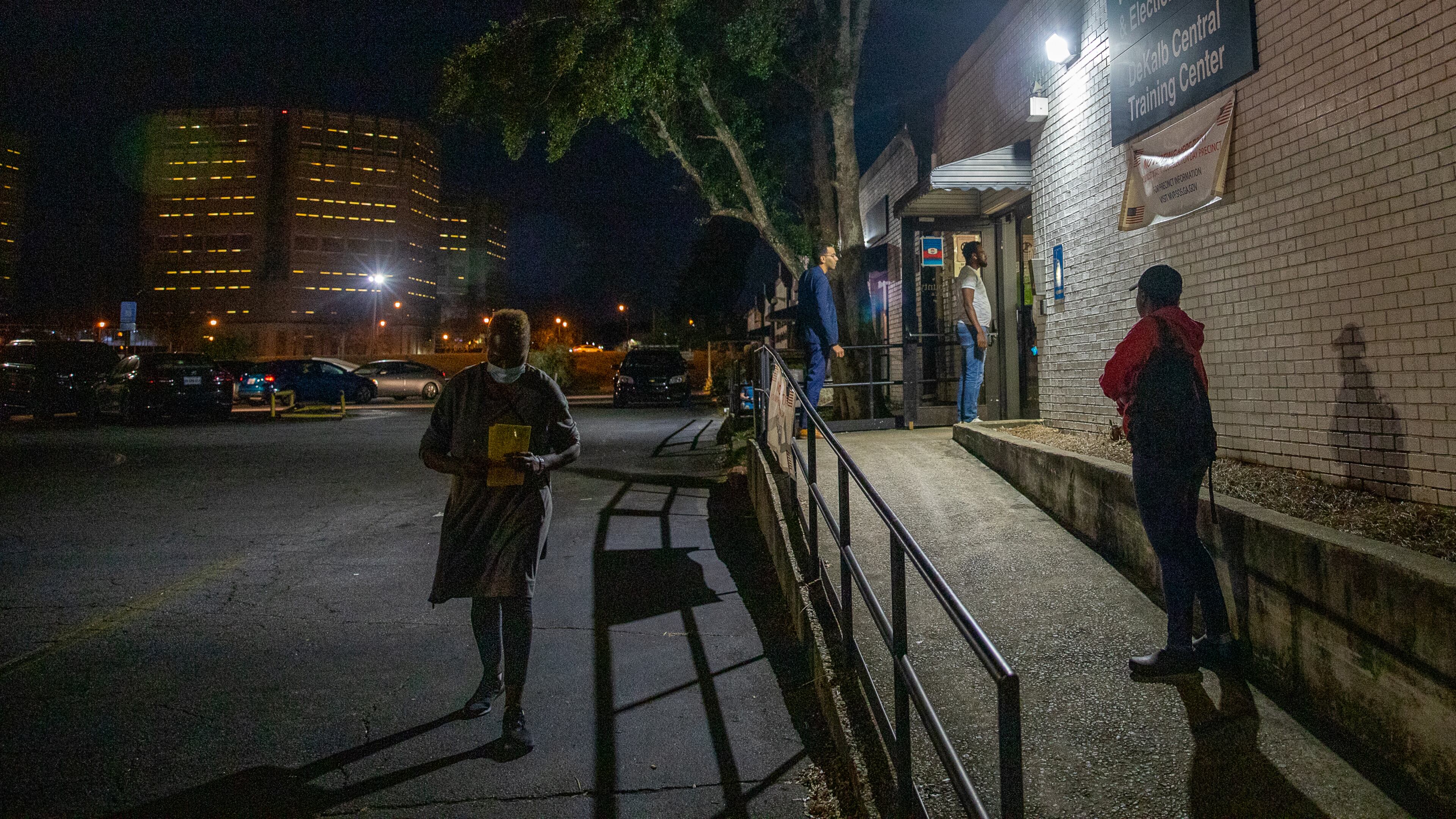 Before the poles close, DeKalb residents bring in their absentee ballots to the DeKalb County Elections Office on Tuesday, Nov 8, 2022. (Jenni Girtman for The Atlanta Journal-Constitution)