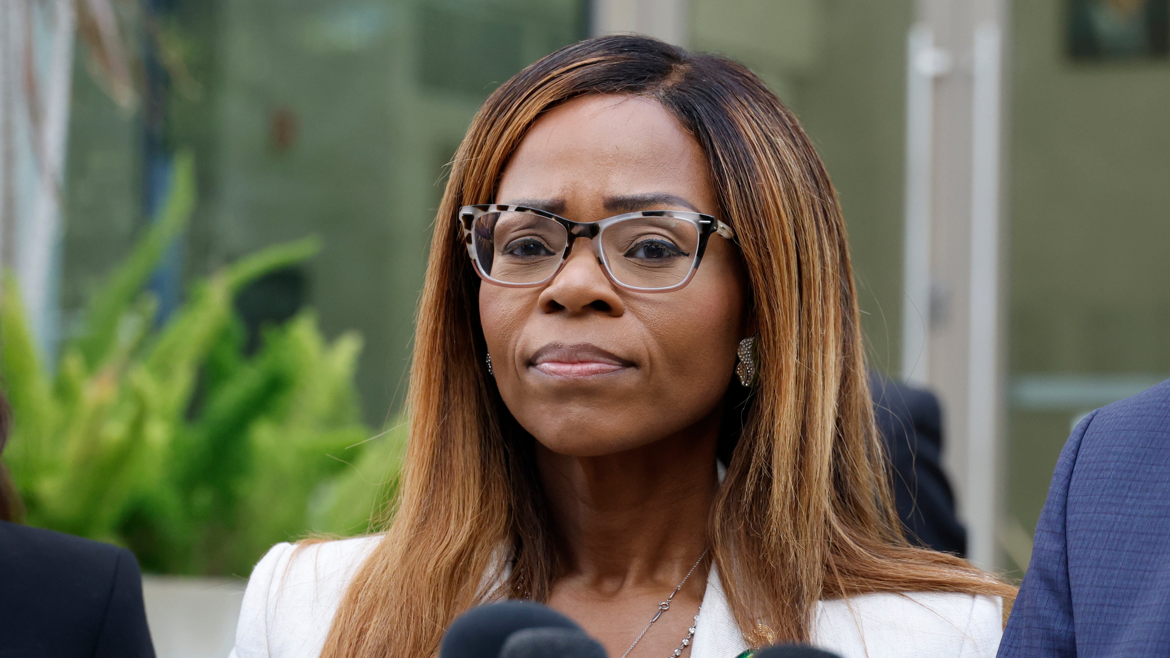 CORRECTS TO HEARING, NOT ARRAIGNMENT - U.S. Rep. Sheila Cherfilus-McCormick, D-Fla., speaks to the media after a hearing in federal court Monday, Dec. 29, 2025 in Miami. (AP Photo/Terry Renna)