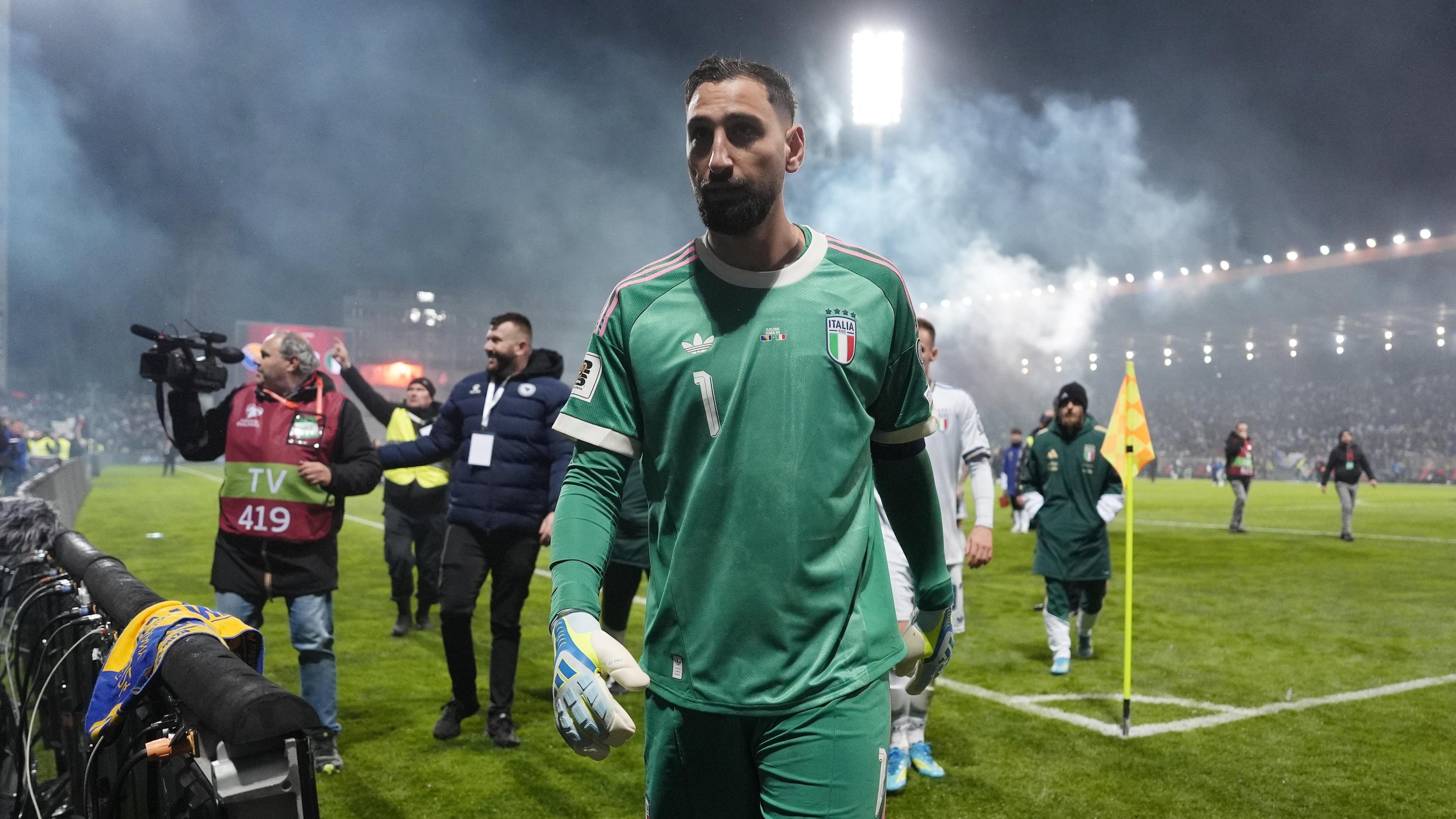 Italy's Gianluigi Donnarumma walks off the pitch after losing in a World Cup qualifying playoff final soccer match between Bosnia and Italy in Zenica, Bosnia, Tuesday, March 31, 2026. (Fabio Ferrari/LaPresse via AP)