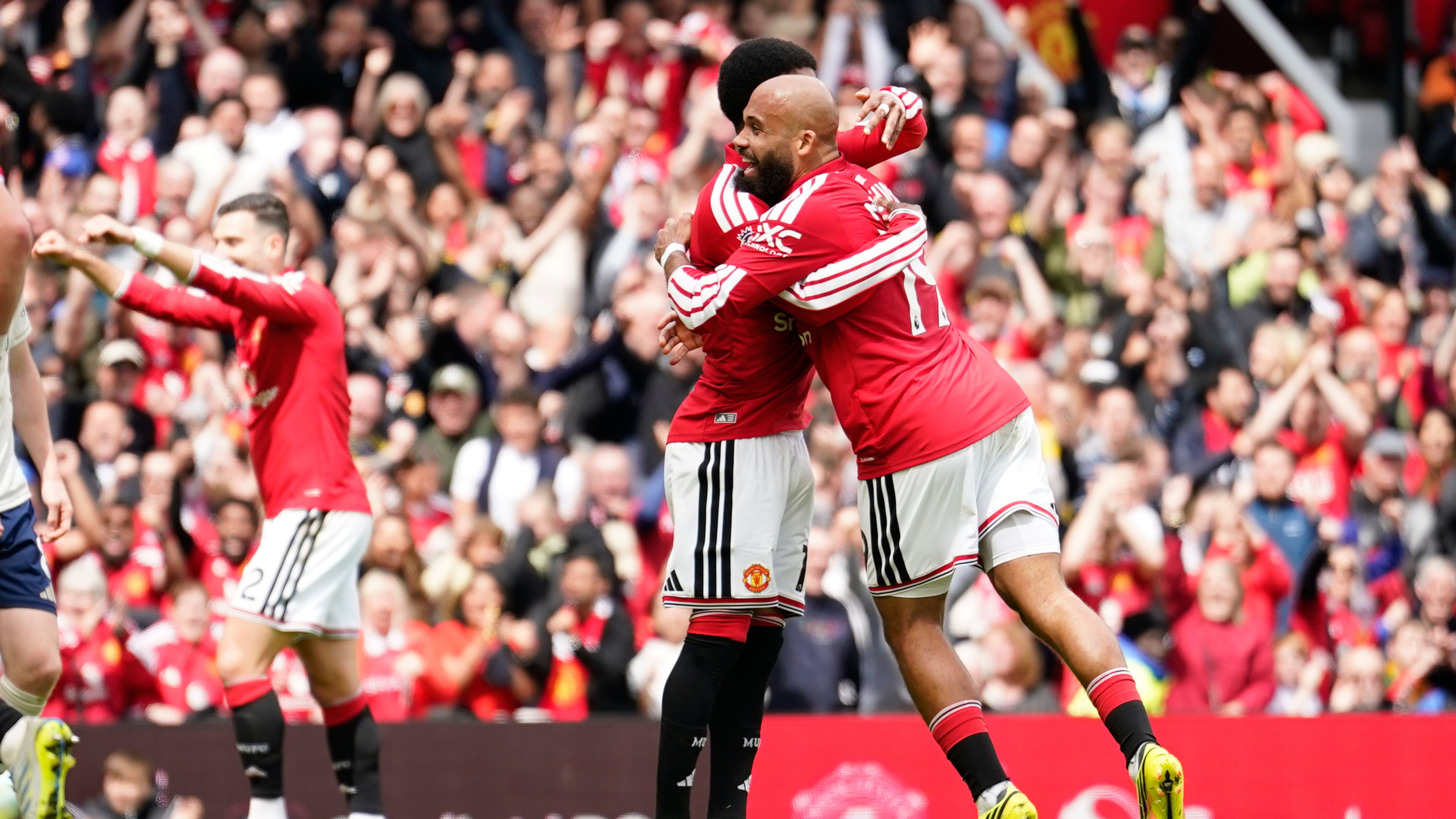 Manchester United's Bryan Mbeumo, right, celebrates after scoring his side's third goal during the English Premier League soccer match between Manchester United and Nottingham Forest in Manchester, England, Sunday, May 17, 2026. (AP Photo/Dave Thompson)