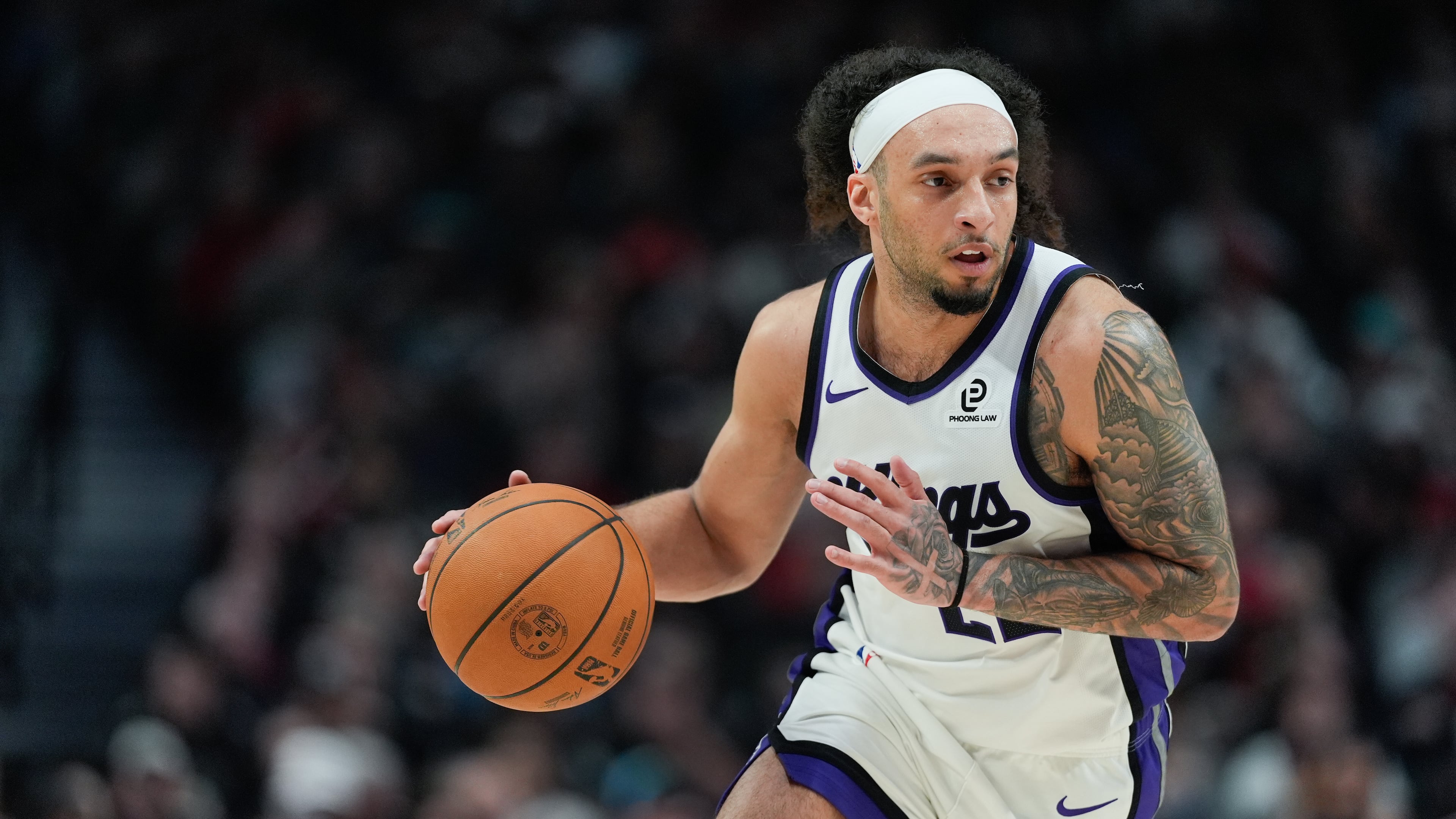 Sacramento Kings guard Devin Carter dribbles during the first half of an NBA basketball game against the Portland Trail Blazers, Sunday, April 12, 2026, in Portland, Ore. (Jenny Kane/AP)