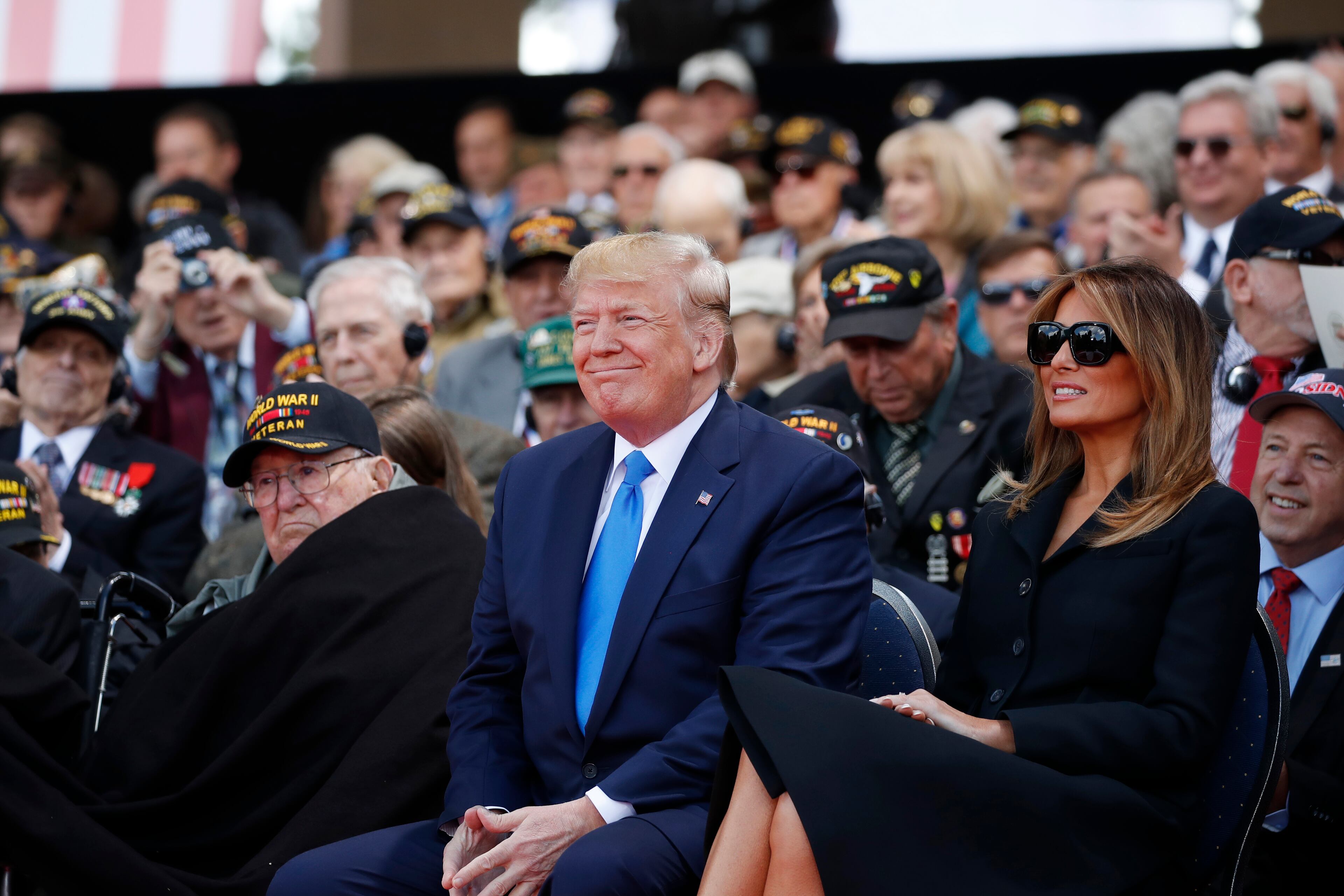 President Donald Trump and first lady Melania Trump, participate in a ceremony to commemorate the 75th anniversary of D-Day at the American Normandy cemetery, Thursday, June 6, 2019, in Colleville-sur-Mer, Normandy, France. (AP Photo/Alex Brandon)