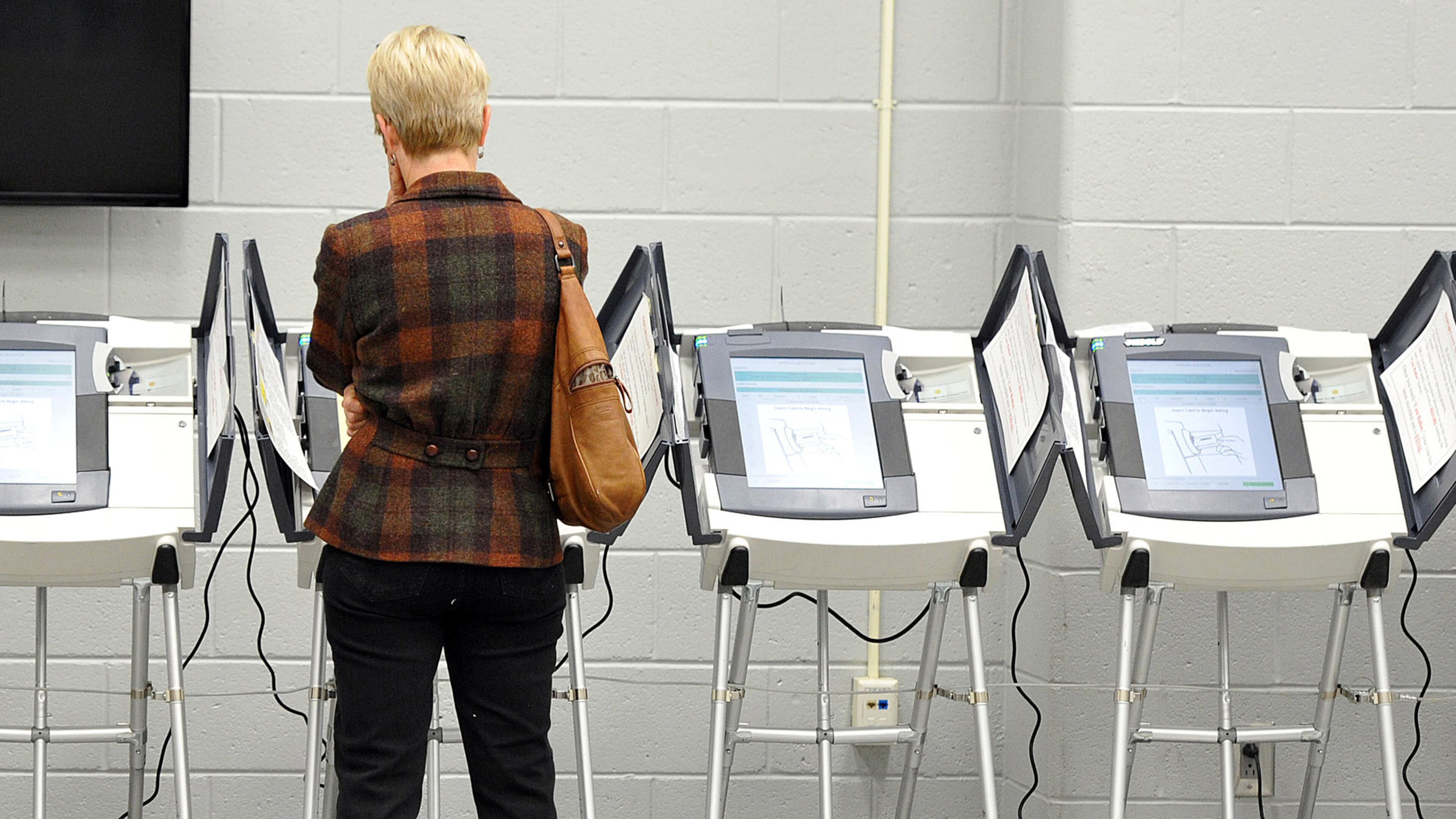 May 2, 2014 Atlanta - An early voter casts her ballot at Adamsville Recreation Center, an early voting site, in Atlanta on Friday, May 2, 2014. HYOSUB SHIN / HSHIN@AJC.COM