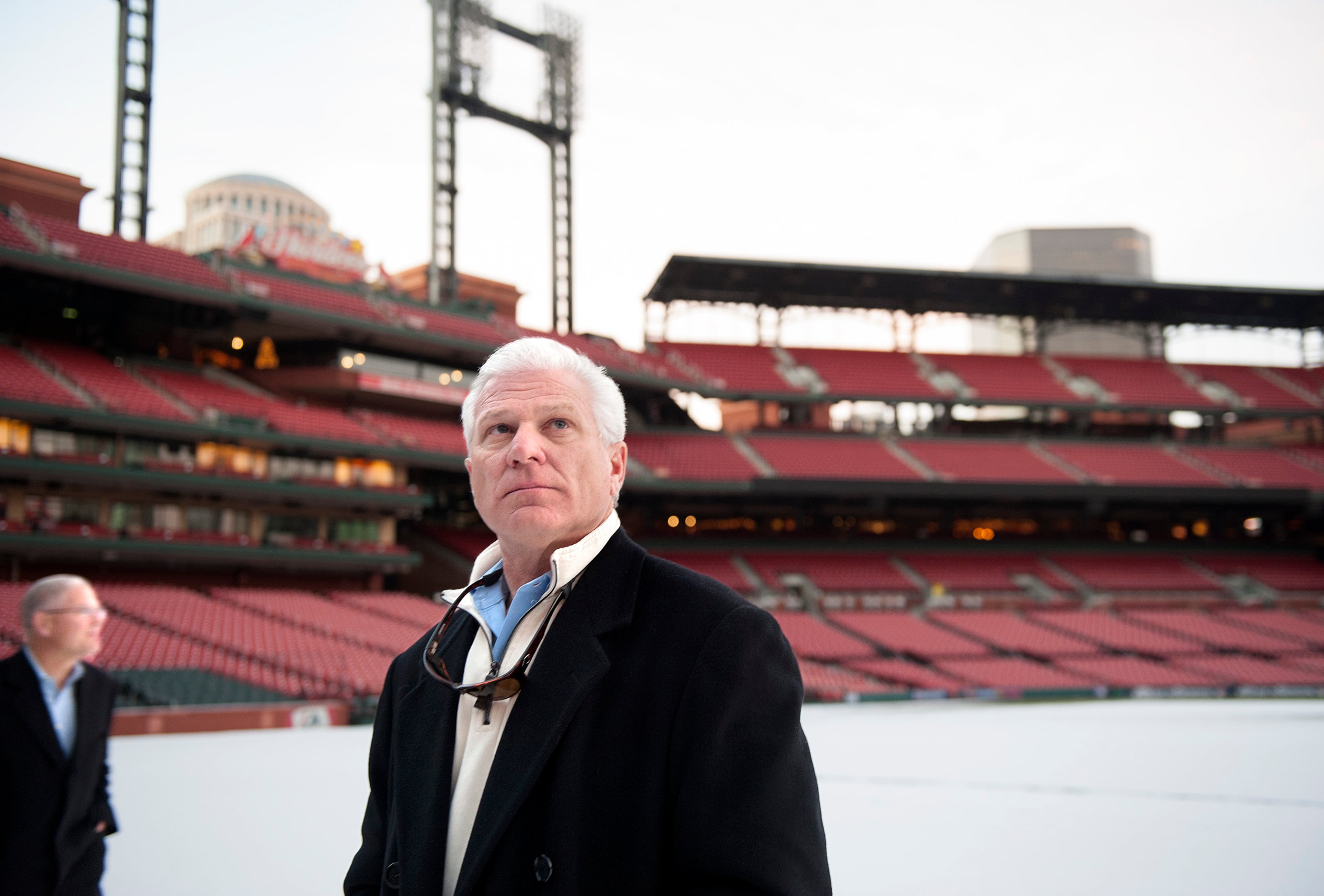 17 DEC. 2013 -- ST. LOUIS -- Atlanta Braves General Manager Frank Wren (right) and David Demarest of Jones Lang LaSalle (left) examine the snow-covered field and stands of Busch Stadium, home of the St. Louis Cardinals, during a tour of the stadium and adjoining Ballpark Village development Tuesday, Dec. 17, 2013. Photo by Sid Hastings.