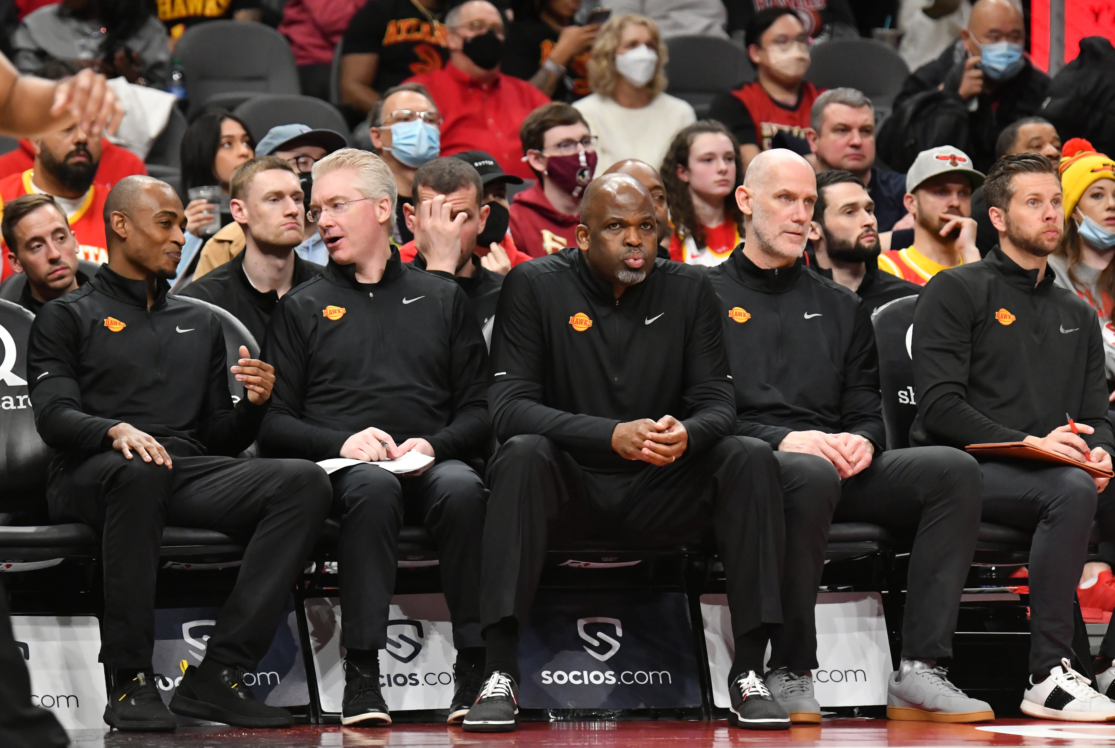 Atlanta Hawks head coach Nate McMillan (center) and staff watch at the end of the fourth quarter against the Raptors at State Farm Arena on Saturday, February 26, 2022. The Hawks won 127-100. (Hyosub Shin / Hyosub.Shin@ajc.com)