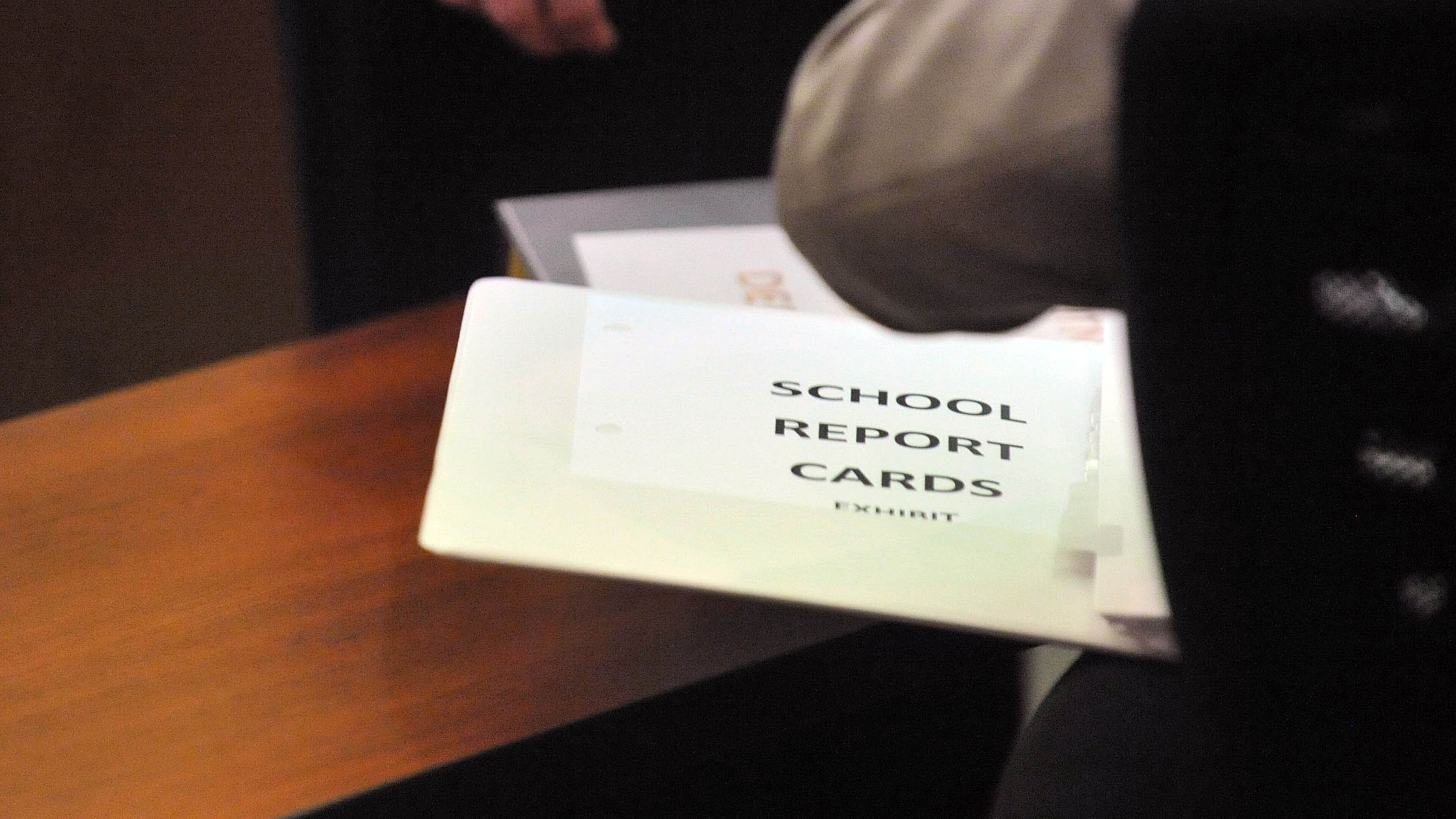 A notebook of School Report Cards from Dunbar and other schools wason the prosecution table as a jury deliberated the fate of educators accused in the Atlanta Public Schools test-cheating trial. Kent D. Johnson/AJC
